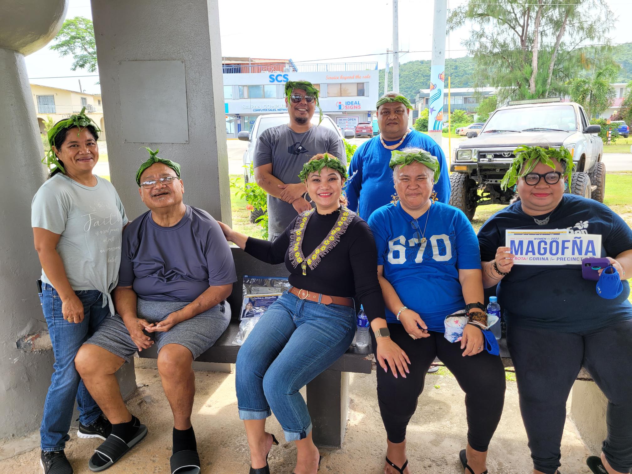 House Precinct 3 candidate Corina L. Magofna, 3rd left seated, poses with supporters at the 13 Fishermen Pavilion in Garapan on Wednesday morning. 