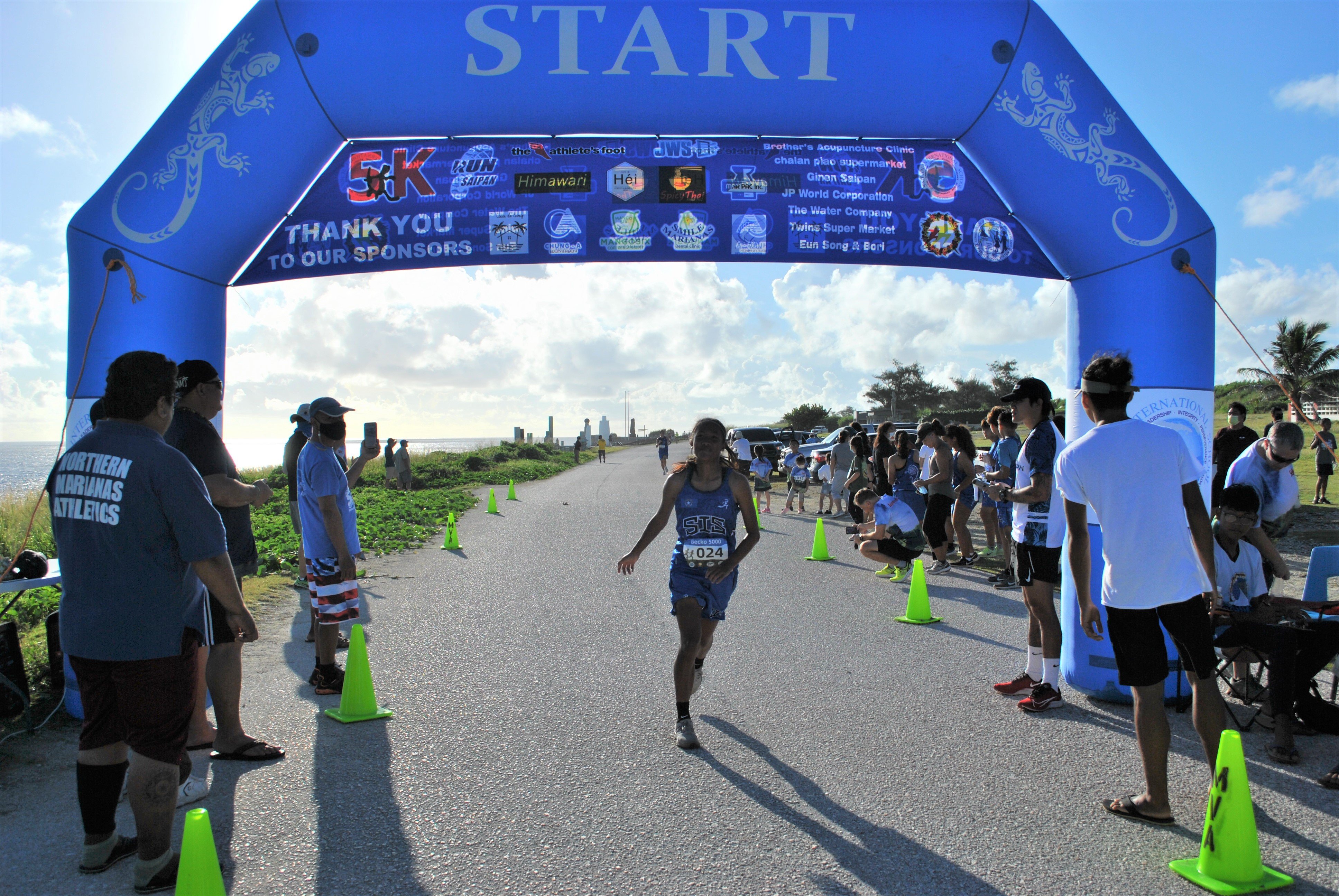 Kaithlyn Chavez crosses the finish line during the 2021-2022 PSS/NMA Cross Country Qualifier 1 at Banzai Cliff on Saturday.