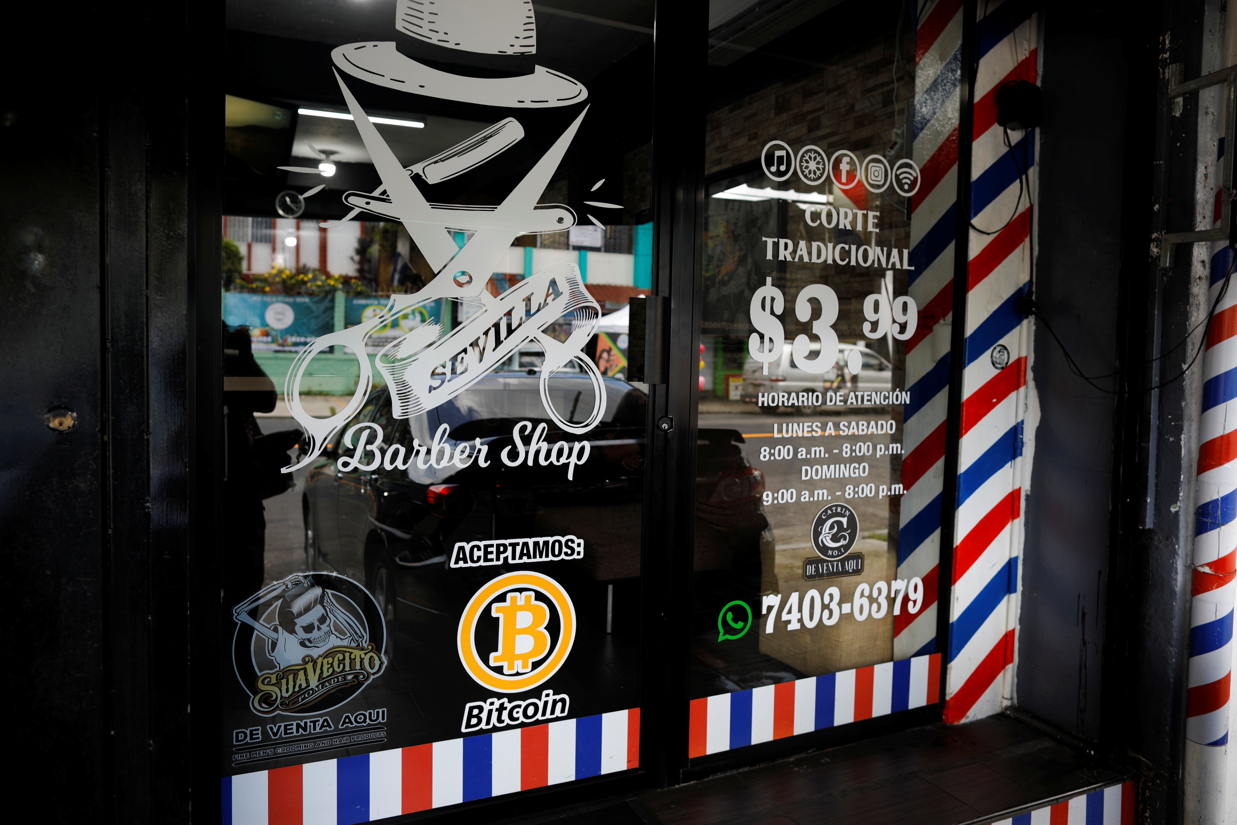 Bitcoin logo is seen outside at Sevilla Barber Shop where Bitcoin is accepted as a payment method in Santa Tecla, El Salvador on Sept. 6, 2021.
