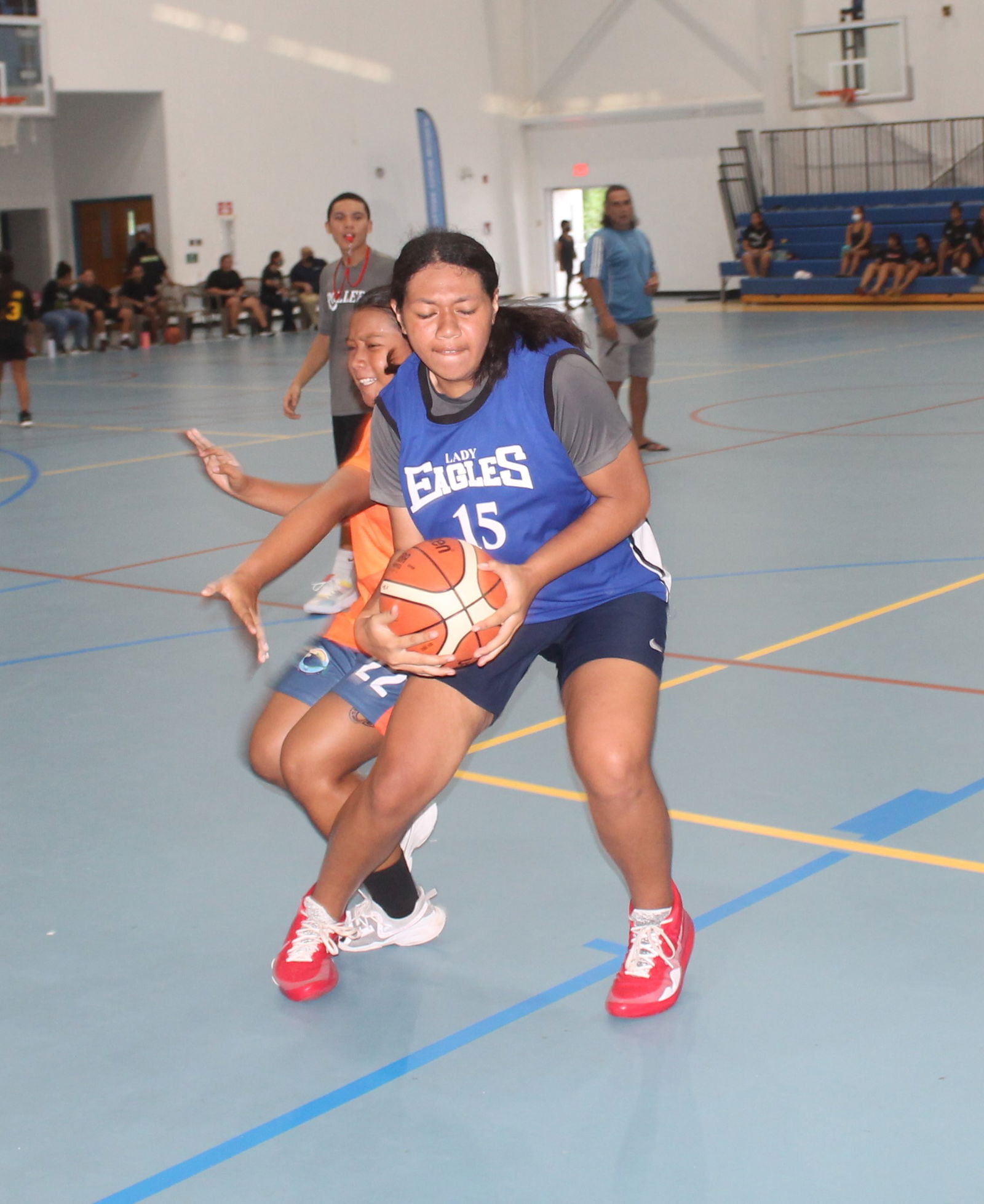 Azriel Fatialofa protects the ball as a defender draws near during an IT&E Interscholastic Girls Middle School Basketball League game Wednesday at the MHS gym.