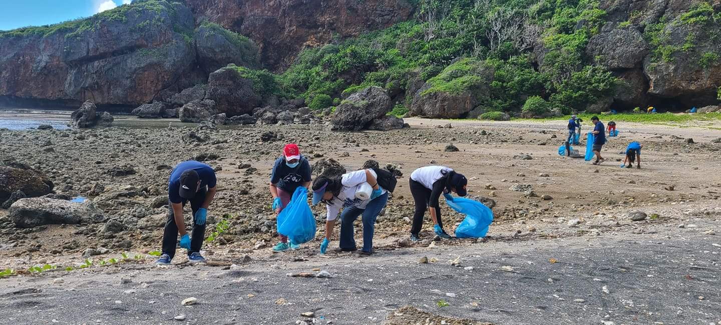 Marianas Variety staff led by their president, Amier C. Younis, pick up litter at Jeffrey's Beach in Talafofo on Saturday morning.
