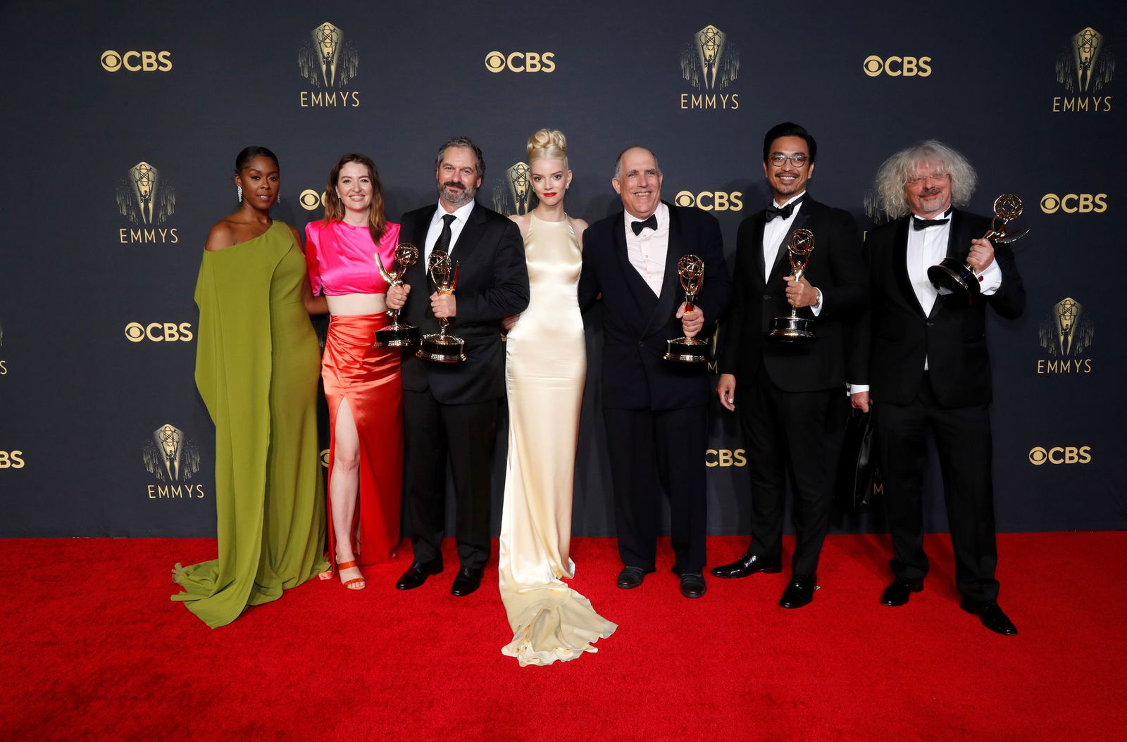 Actors Moses Ingram, Marielle Heller and Anya Taylor-Joy pose for a picture along with producers Scott Frank, Allan Scott, Mick Ancieto and Marcus Loges, with their awards for "The Queen's Gambit" at the 73rd Primetime Emmy Awards in Los Angeles on Sept. 19, 2021.
