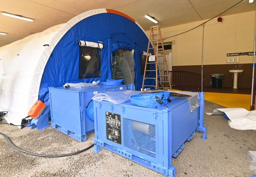 The Guam National Guard was assembling a medical tent at the Guam Memorial Hospital emergency room entrance Wednesday in Tamuning. The tent, equipped with negative pressure, now houses several Covid-19 patients.