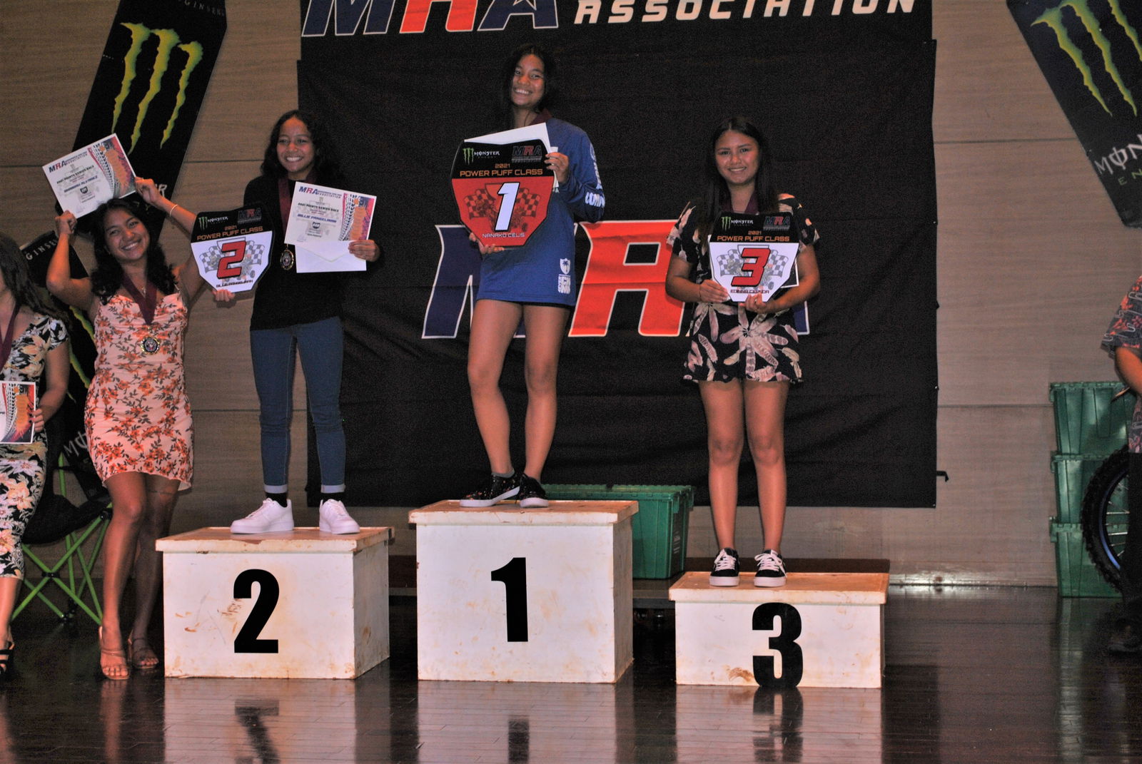 Nanako Celis, center, poses with the red plate trophy of the Power Puff Girls Class during the Marianas Racing Association 2021 Points Race Series awards ceremony at the Saipan World Resort on July 28, 2021.