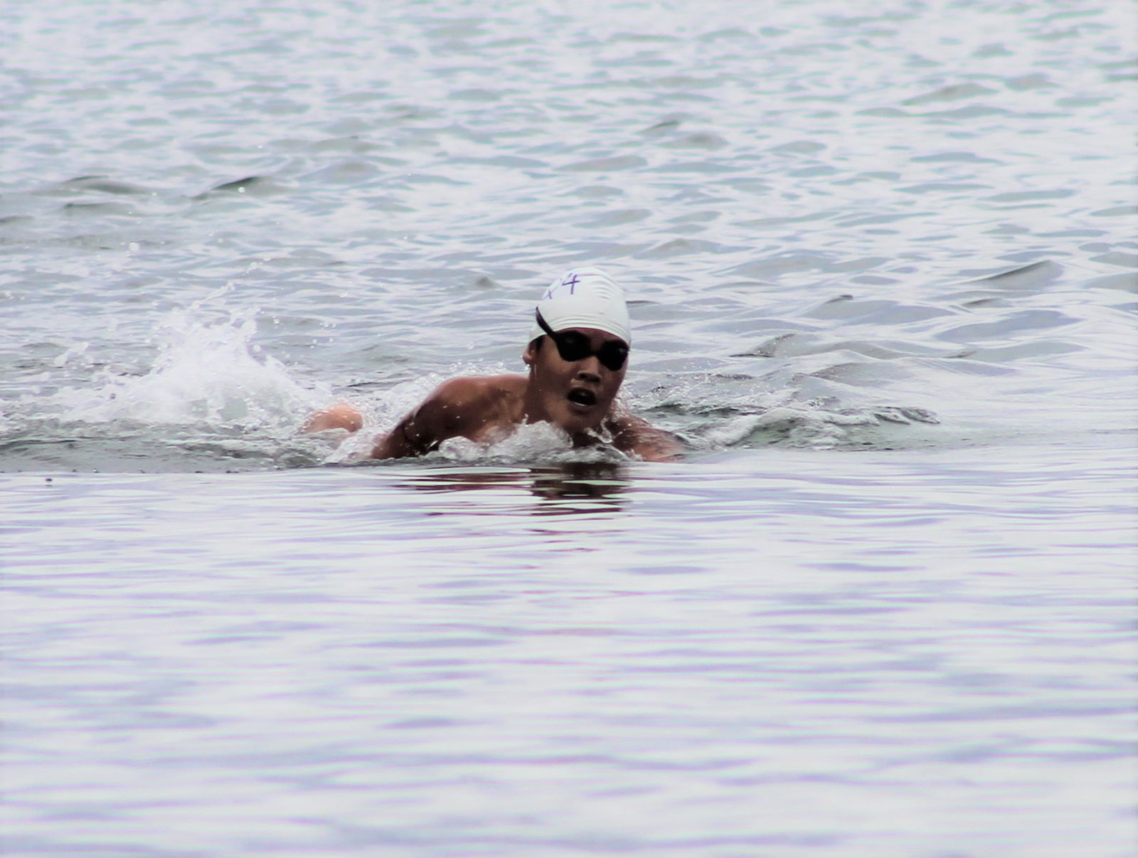 Jinnosuke Suzuki takes a breather during the third 1000m qualifier race of the Saipan Swim Club Triple Crown Open Water Swim Series on Saturday at Guma Sakman.