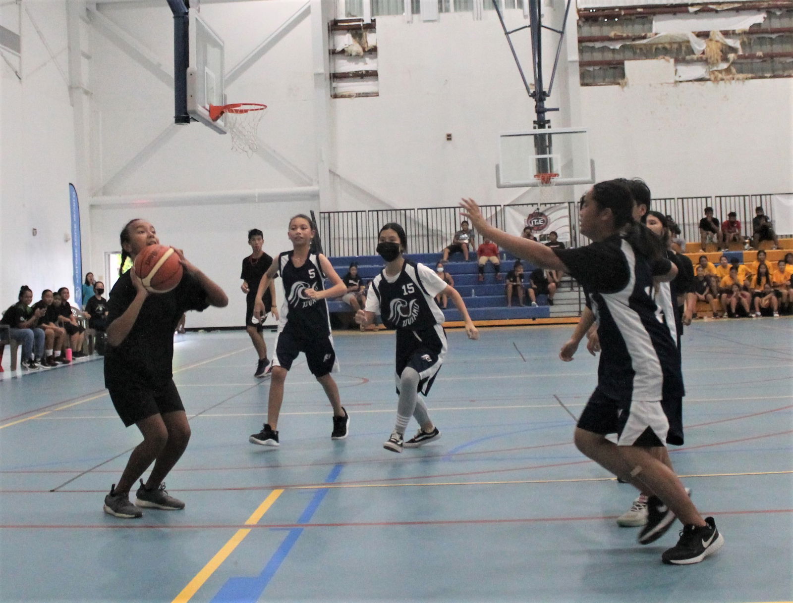 A Dandan Middle School player gathers for the shot during an IT&E Interscholastic Girls Middle School Basketball League game Wednesday at the MHS gym.