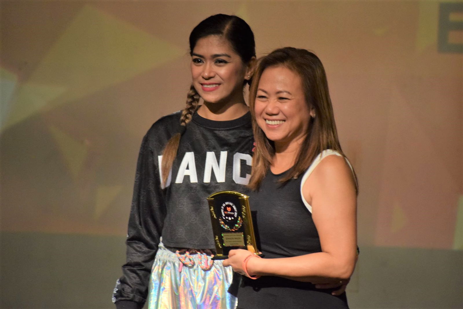 Fitness instructor Mary Grace Bautista, left, poses with Ednalyn Waldo who received an appreciation award during the M2 Fitness first anniversary celebration at the Saipan World Resort on Aug. 28, 2021.
