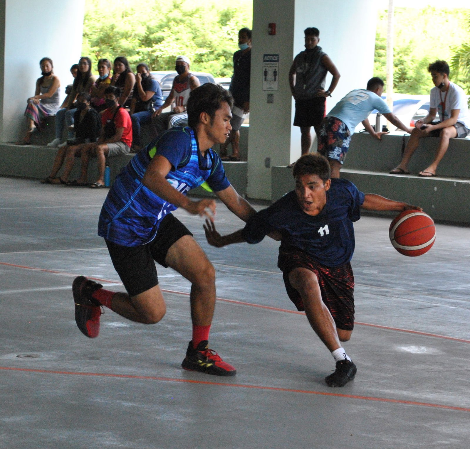 The Ol'Aces' Kevin Kabriel dribbles past a Marianas Dental Center defender  during a game of the NMI Rollers Basketball Association Men's Tournament on Sunday at the Koblerville gym.