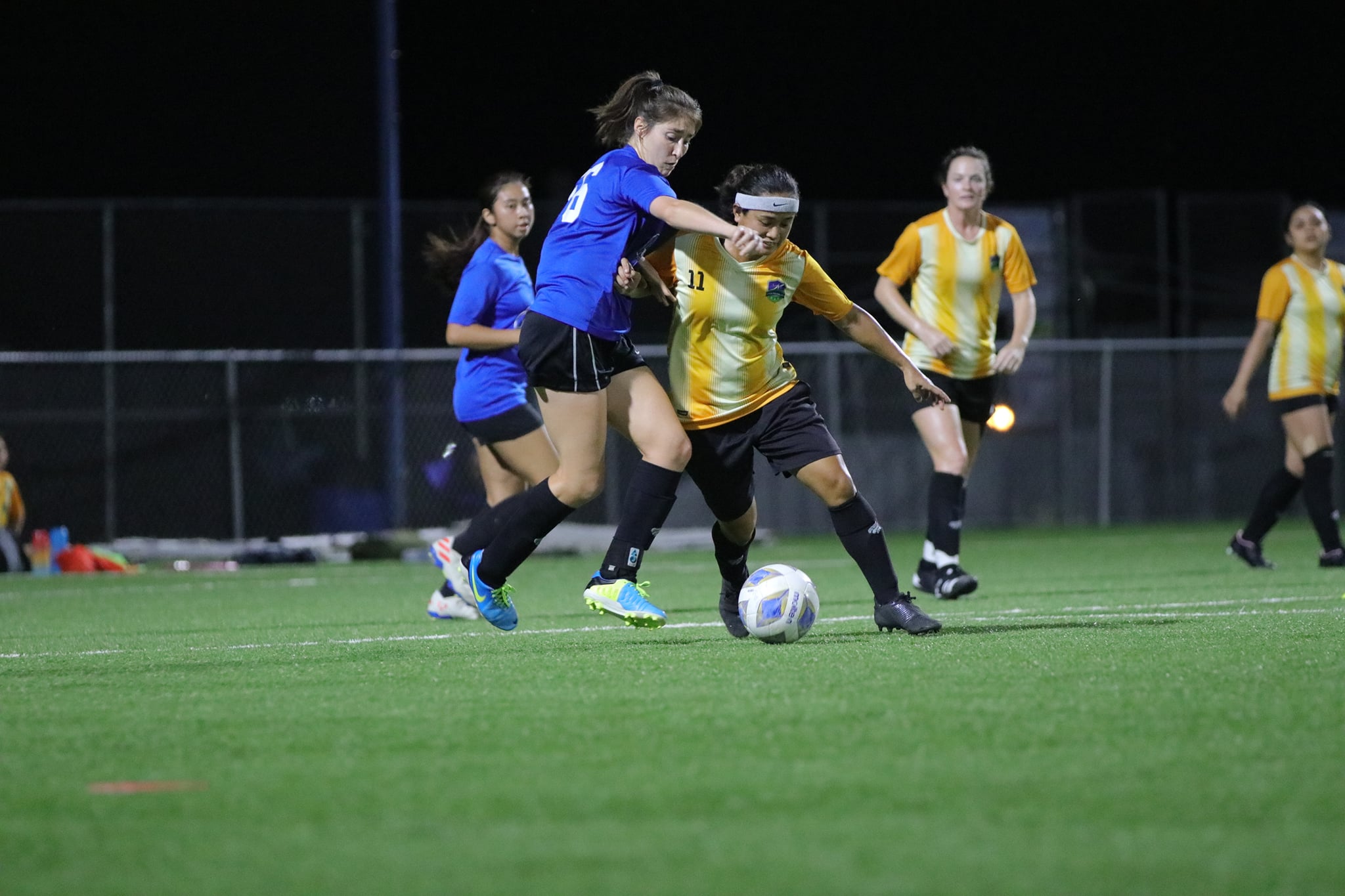 Kanoa’s Irish Pagarao battles for the possession against Shirley’s Gabriel Race during a  Premier Division game of the Dove Women's League Summer 2021 tournament last week at the NMI Soccer Training Center.