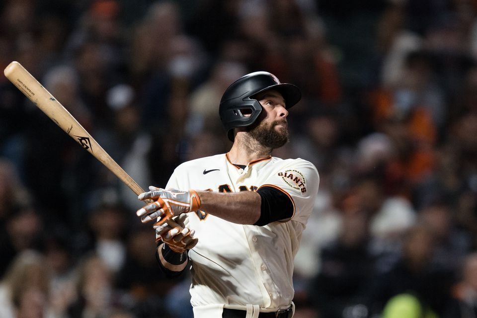 San Francisco Giants first baseman Brandon Belt (9) hits a two-run home run against the San Diego Padres in the fourth inning at Oracle Park in San Francisco, California on Sept. 13, 2021.