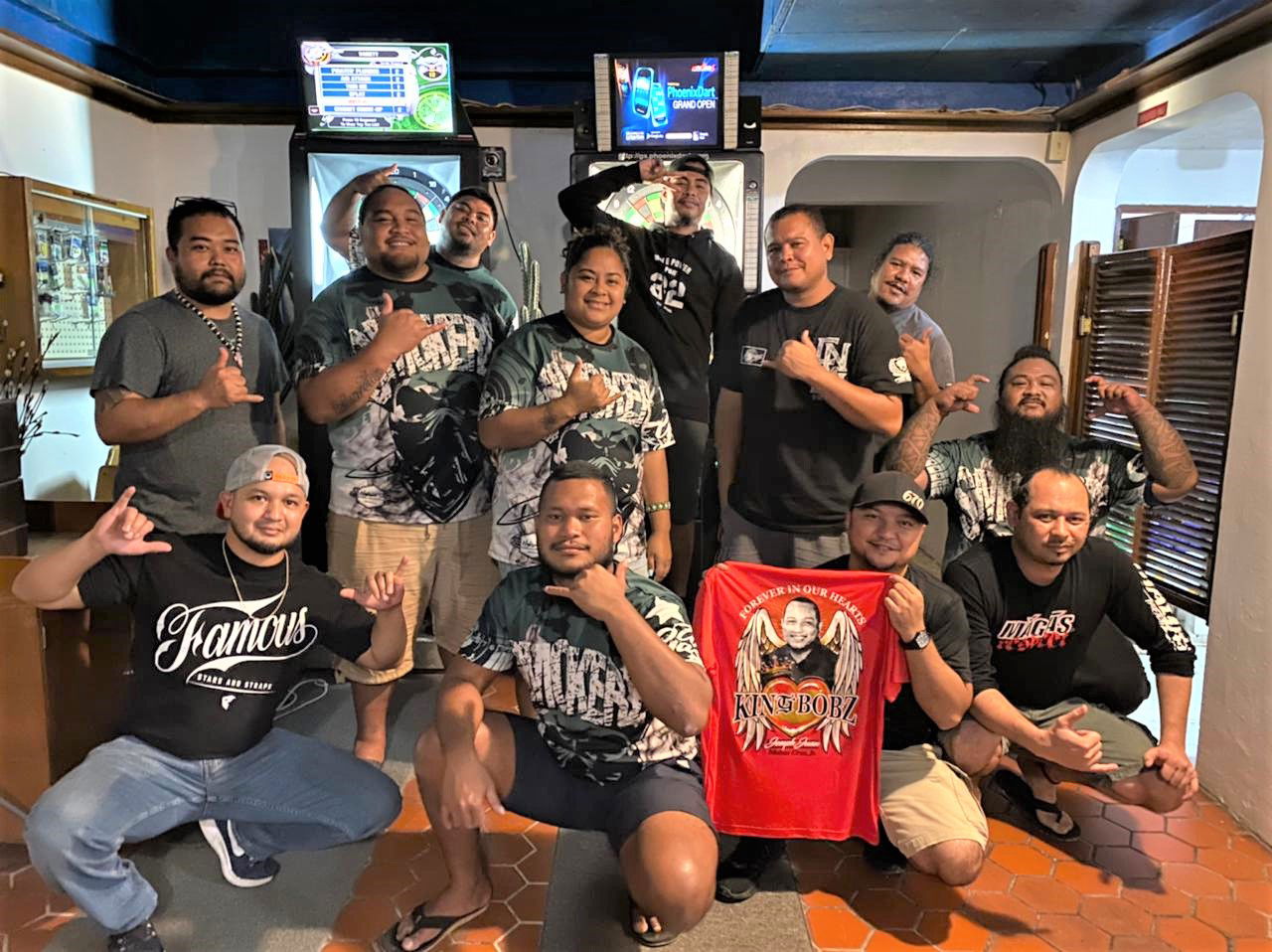 The Oleai Smokerz and JustChillin Serial Killaz pose for a photo after their match  in the Flame Tree Thursday B Division of the SEDA Bud Light League at the Oleai Bar & Grill.