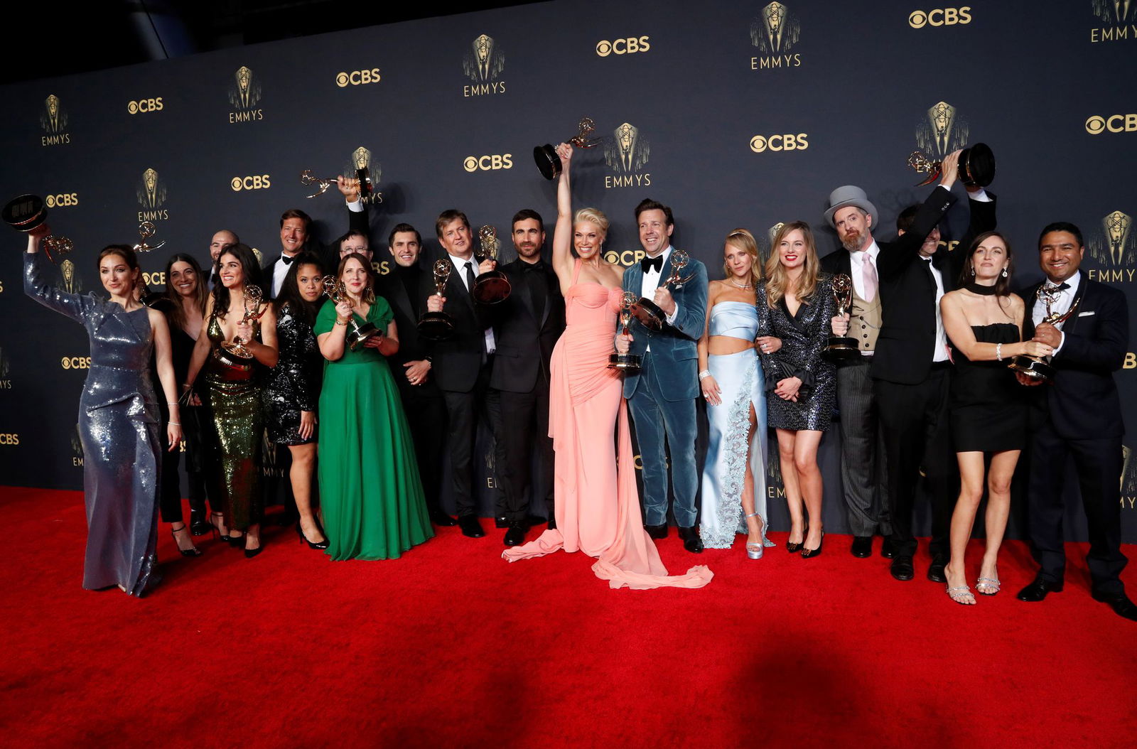 The cast and crew members of comedy series "Ted Lasso" pose for a picture with their awards at the 73rd Primetime Emmy Awards in Los Angeles on Sept. 19, 2021.