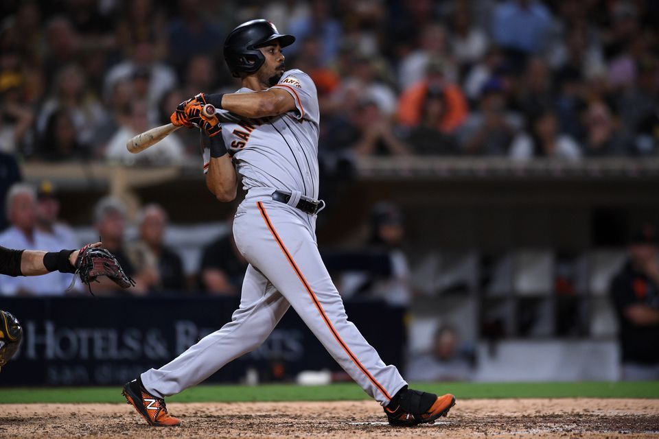 San Francisco Giants right fielder LaMonte Wade (31) hits an RBI single against the San Diego Padres during the ninth inning at Petco Park in San Diego, California on  Sept. 21, 2021.
