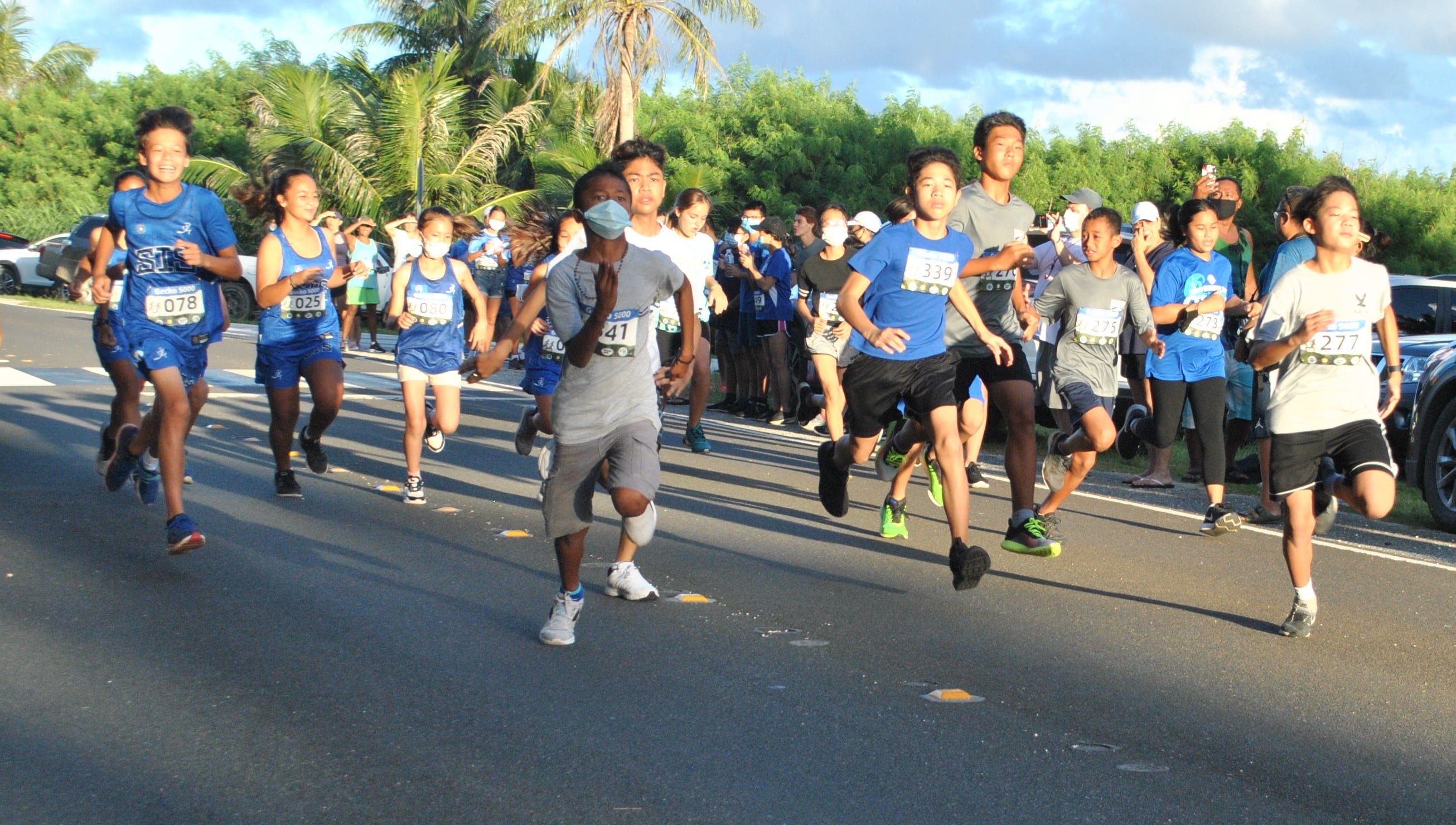Runners take off at the starting point of the 2021-2022 PSS/NMA Cross Country Qualifier 1 at Banzai Cliff on Saturday.