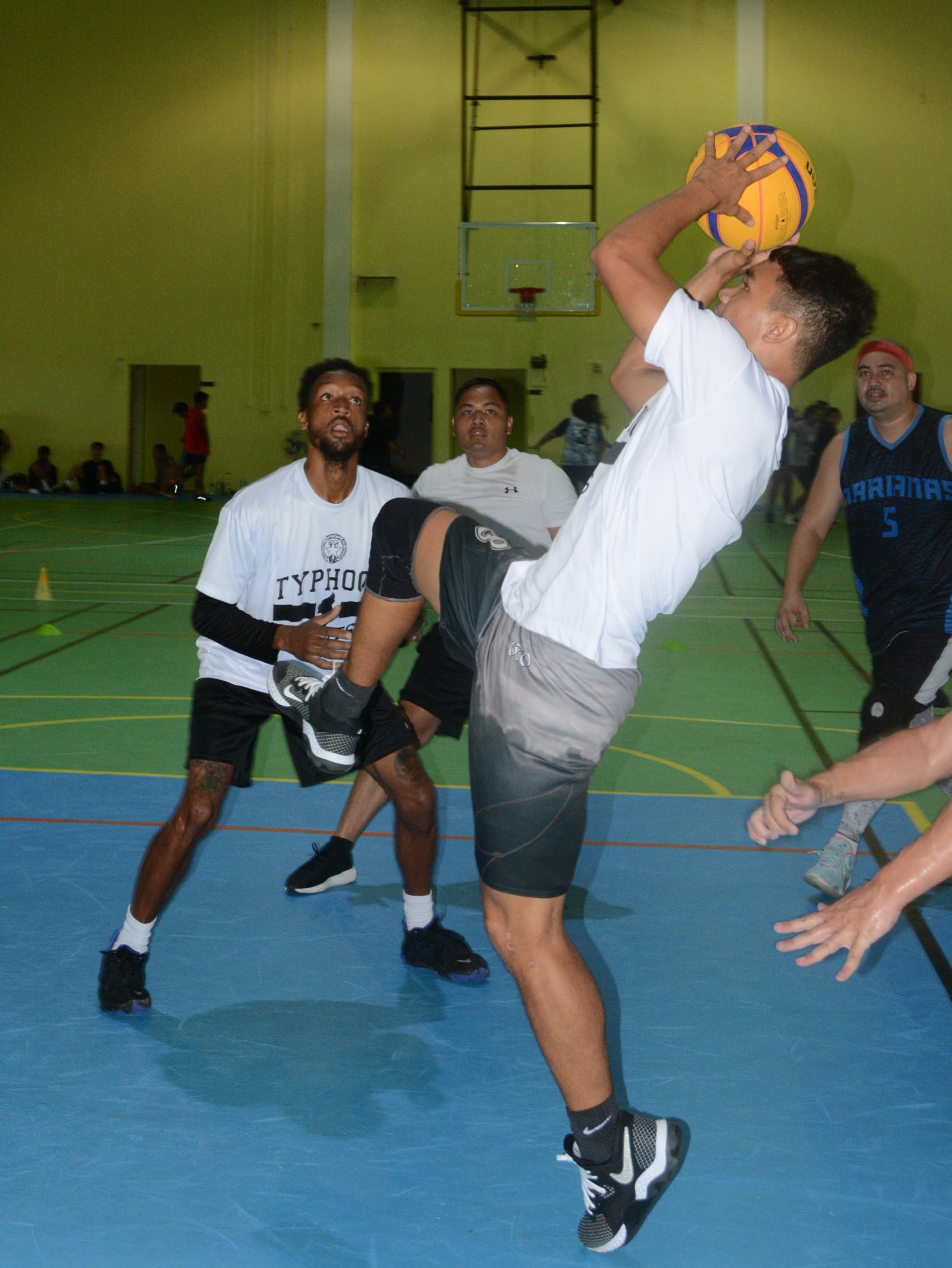 Tinian’s Sir Dela Cruz takes an off-balanced shot while his teammates look on during their match against The Game in the Northern Mariana Islands Basketball Federation 3x3 Hoop Fest held  Oct. 16 at the Gilbert C. Ada Gymnasium.