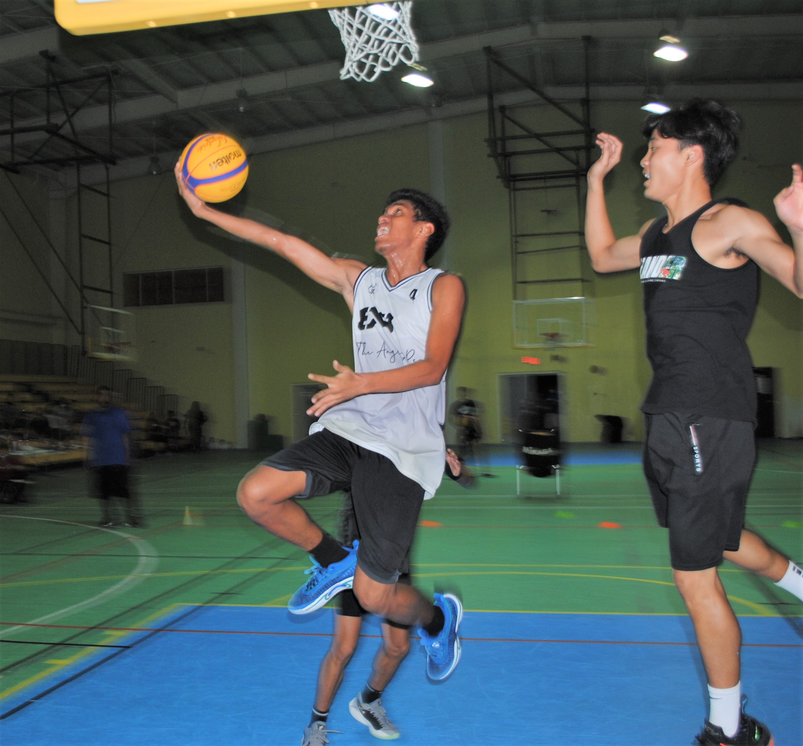 Babenome's KayJay Kabiriel goes for the reverse layup.