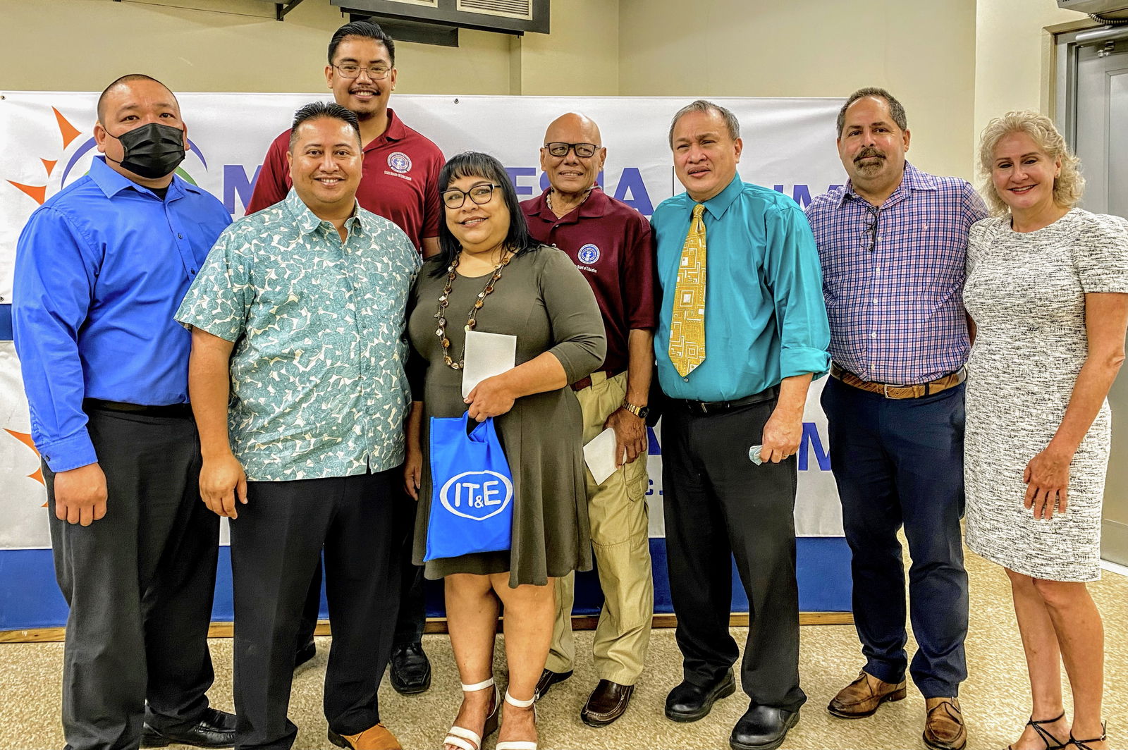From left, acting Commissioner of Education Magofna, Gov. Ralph DLG Torres, Board of Education member Antonio Borja, former BOE Chairwoman Janice Marie A. Tenorio, BOE Vice Chairman Herman Atalig, BOE Chairman Andrew L. Orsini, Micronesia Renewable Energy Chief Operations Officer Jeffrey Voacolo and his wife Tracy.