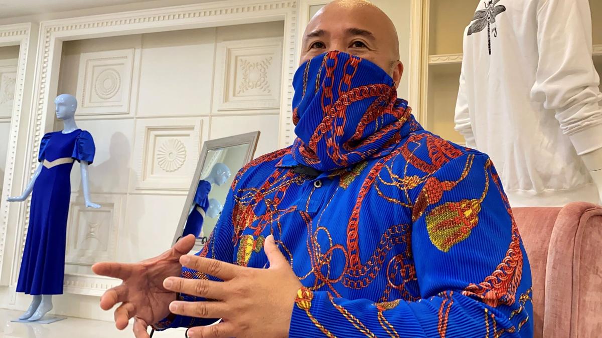 Norman Analista gestures during an interview with The Guam Daily Post at his store on the second floor of Tumon Sands Plaza.