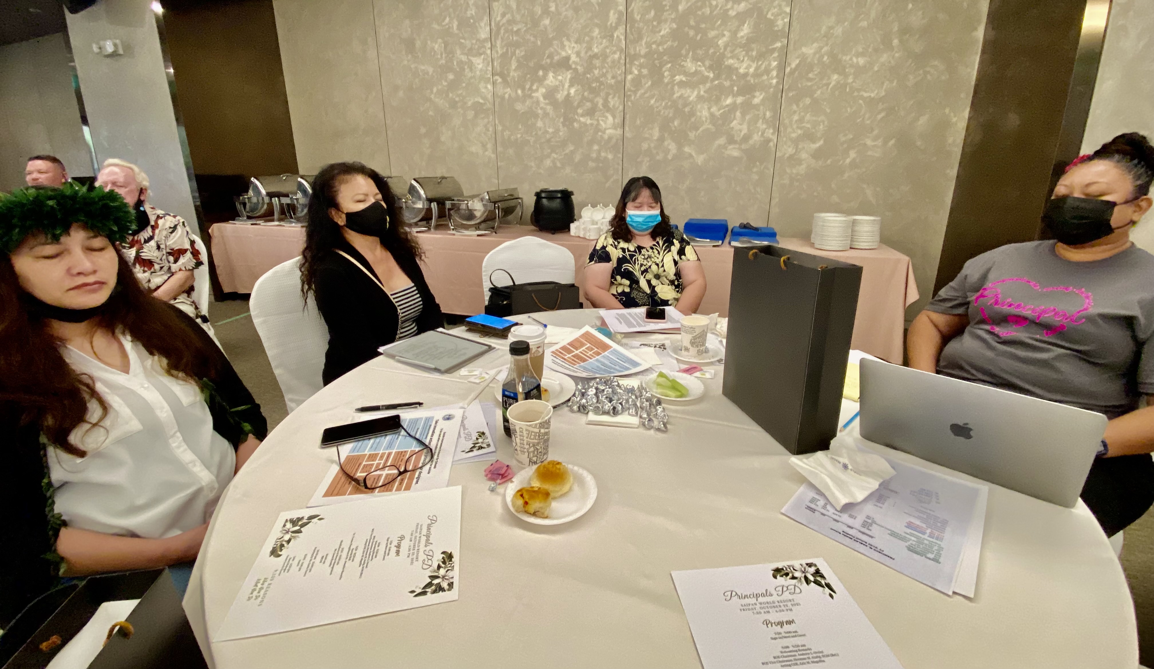 Principals Hilda Rios, Elizabeth Hofschneider, and Cherlyn Osung with Dr. Rizalina Liwag, PSS senior director for accountability, research and evaluation.