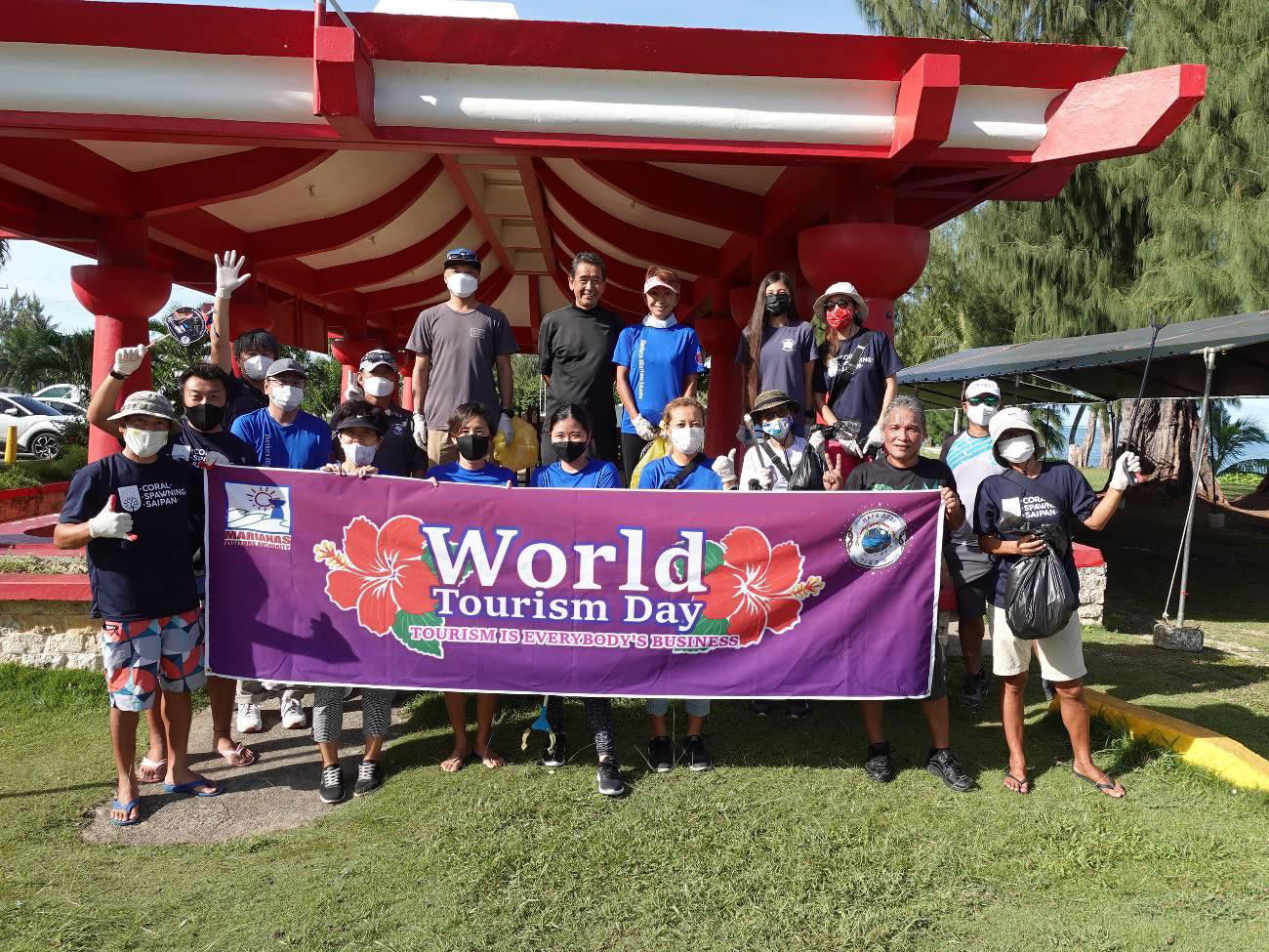 Representatives of the Japanese Society of the Northern Marianas, Saipan Keepers CNMI, and Marianas Visitors Authority conduct a beach cleanup beginning at Kilili Beach Park in Saipan on Sept. 27, 2021, in celebration of World Tourism Day.  Other volunteers begin at the Japanese tank in Chalan Laulau, Saipan.