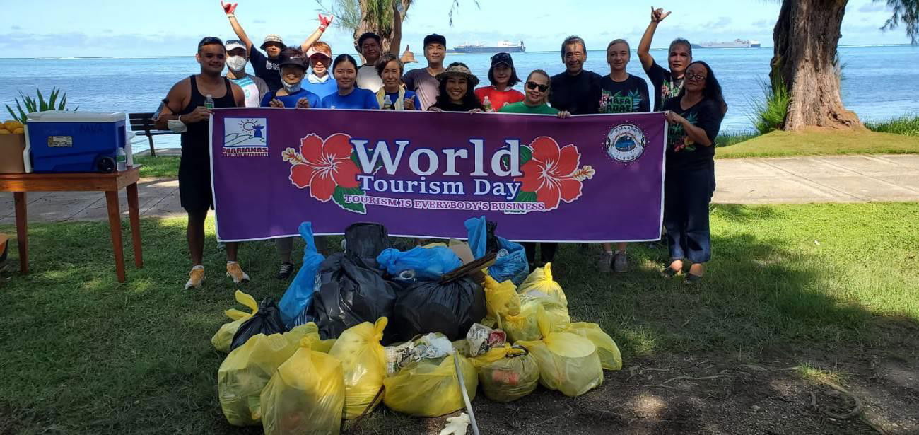 Representatives of the Japanese Society of the Northern Marianas, Saipan Keepers CNMI, and Marianas Visitors Authority and Miss Marianas Savannah Delos Santos conduct a beach cleanup beginning at Kilili Beach Park in Saipan on Sept. 27, 2021, in celebration of World Tourism Day.