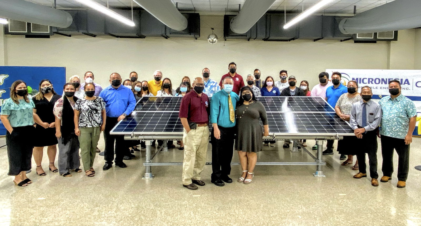 Acting Commissioner of Education Eric Magofna, Board of Education Chairman Andrew L. Orsini, Vice Chairman Herman Atalig and BOE member Antonio Borja pose for a photo with former BOE Chairwoman Janice Marie A. Tenorio, Gov. Ralph DLG Torres, Lt. Gov. Arnold I. Palacios, Speaker Edmund Villagomez, Senate President Jude Hofschneider, Micronesia Renewable Energy Chief Operations Officer Jeffrey Voacolo and other lawmakers and education officials following the unveiling of the solar energy system initiative of the Public School System in the Marianas High School cafeteria on Thursday.