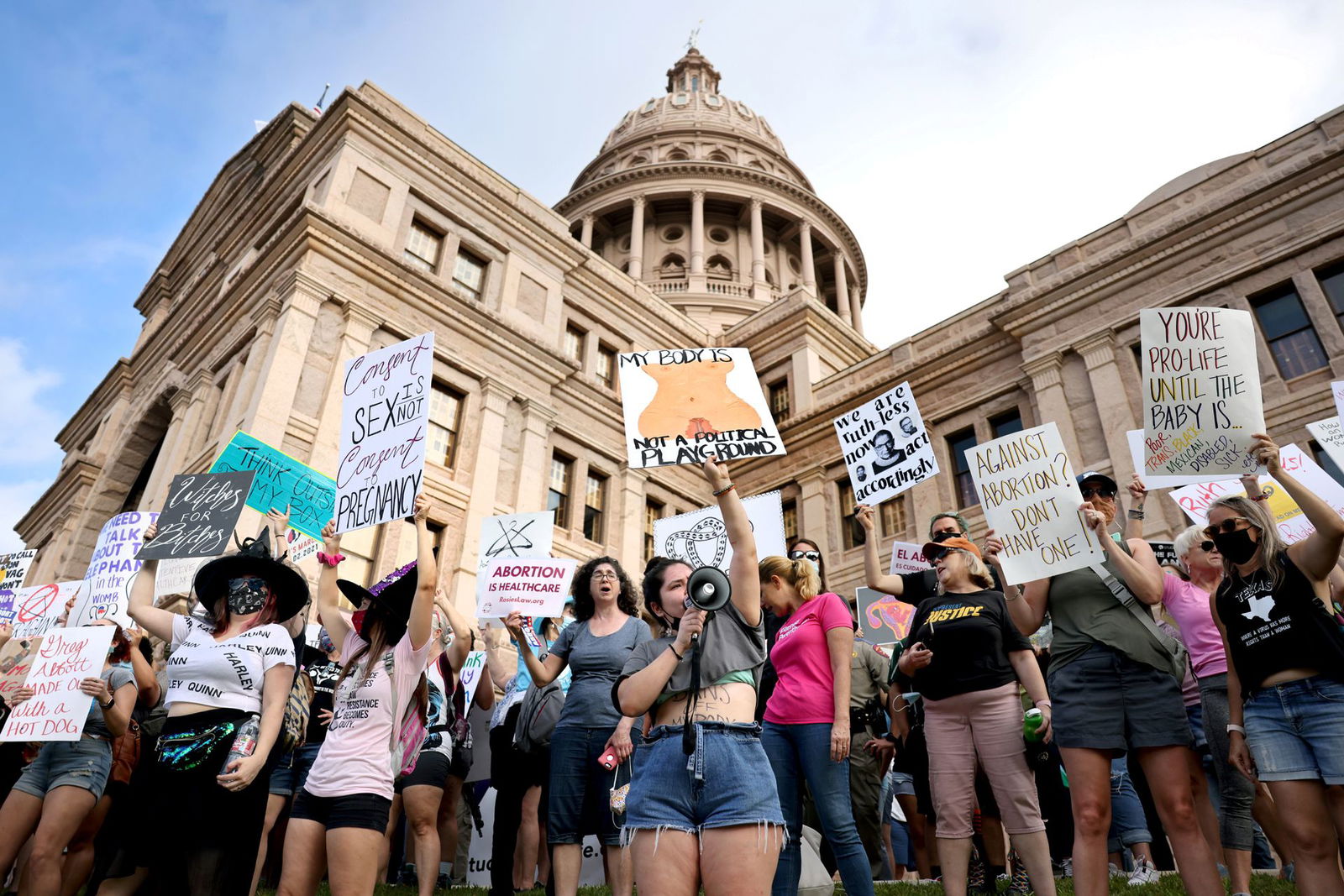 Women's rights advocates participate in the nationwide Women's March, held after Texas rolled out a near-total ban on abortion procedures and access to abortion-inducing medications, in Austin, Texas on Oct. 2, 2021.