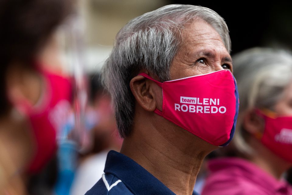 A supporter of Philippine Vice President Maria Leonor "Leni" Robredo wears a face mask bearing her name at the Office of the Vice President, in Quezon City, Metro Manila on Oct. 7, 2021.