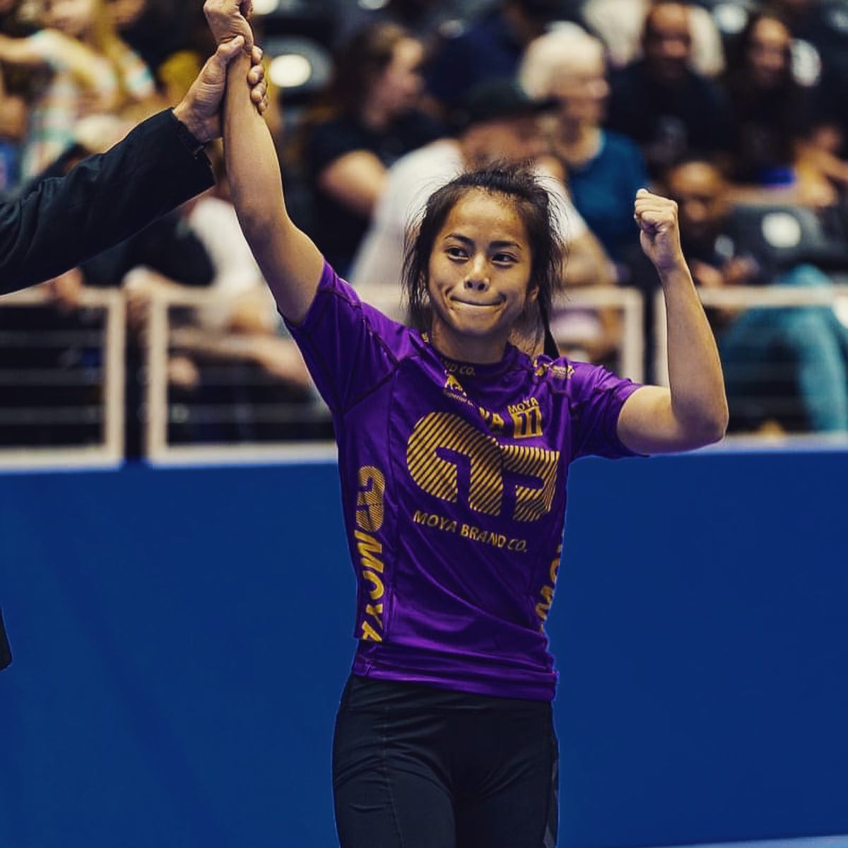 Marilyn Cruz smiles as she wins a purple belt division match during the IBJJF No Gi World Championship in Garland, Texas on Oct. 7, 2021.