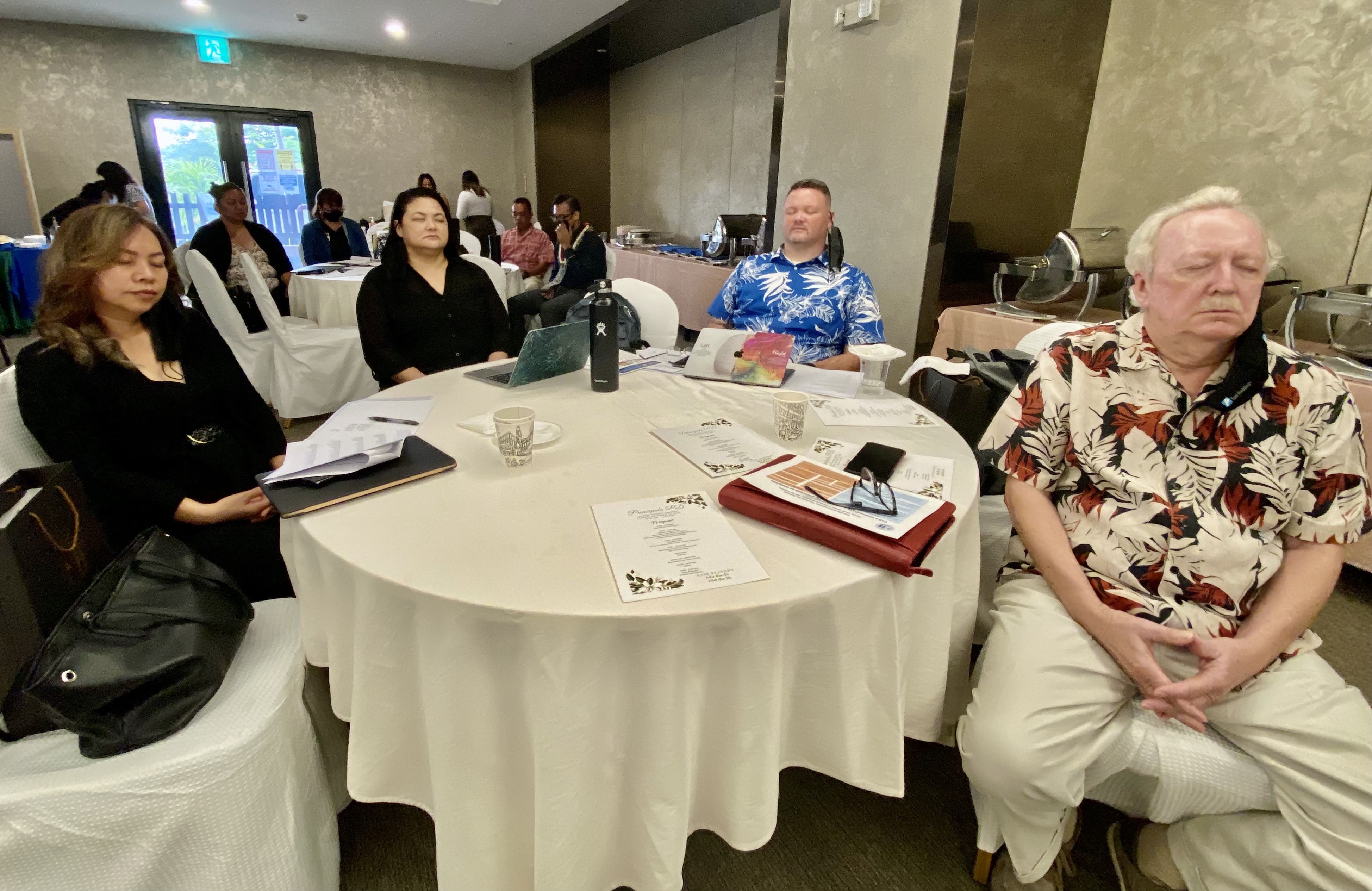 Participating in a “Mindfulness & Stress Management” activity are Principals Naomi Nishimura, Paulette Tomokane and Derwin Santos with PSS Federal Programs Officer Tim Thornburgh.