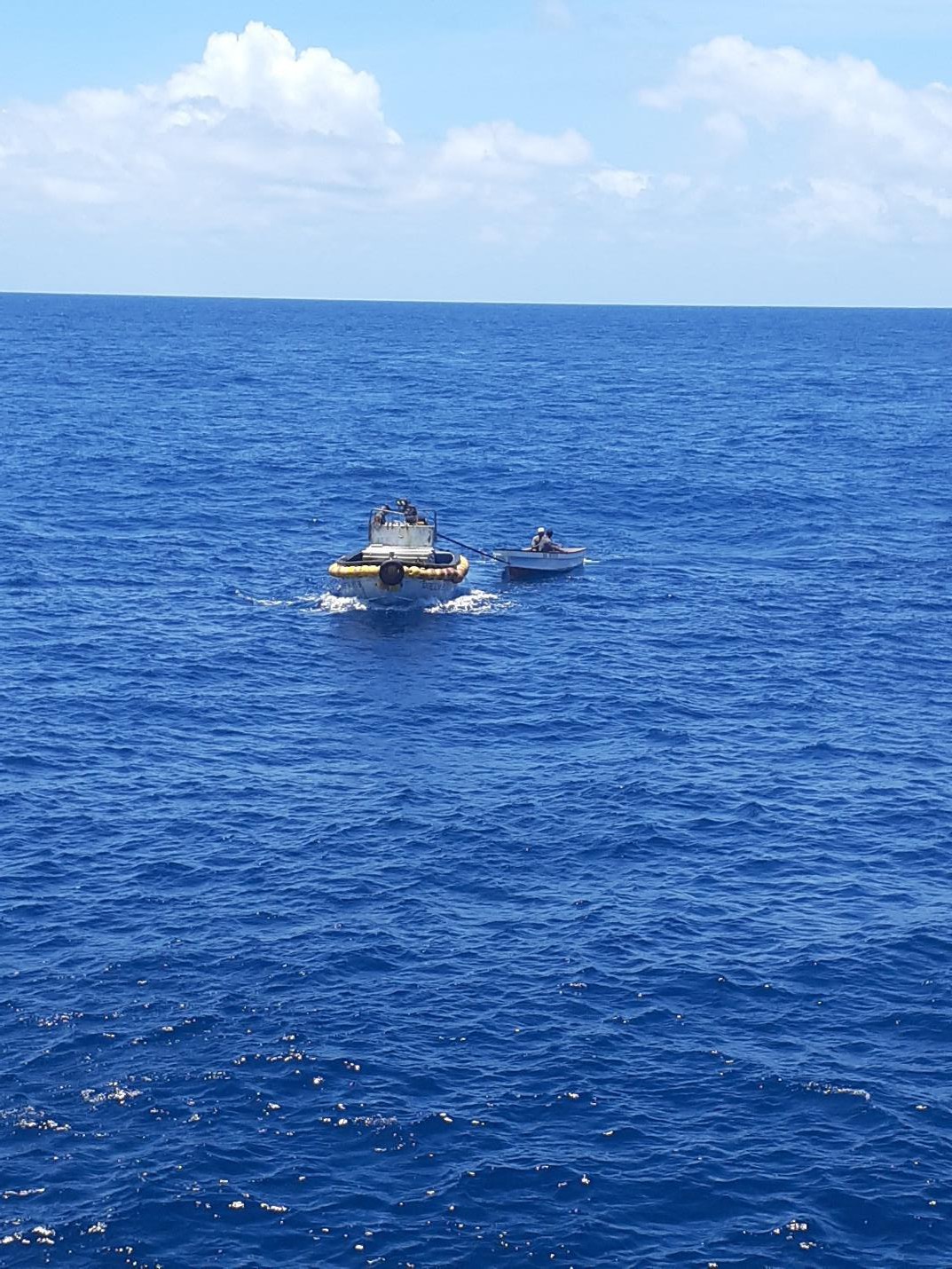 The Queen Elizabeth 959 dispatches a rescue boat to save the fishermen