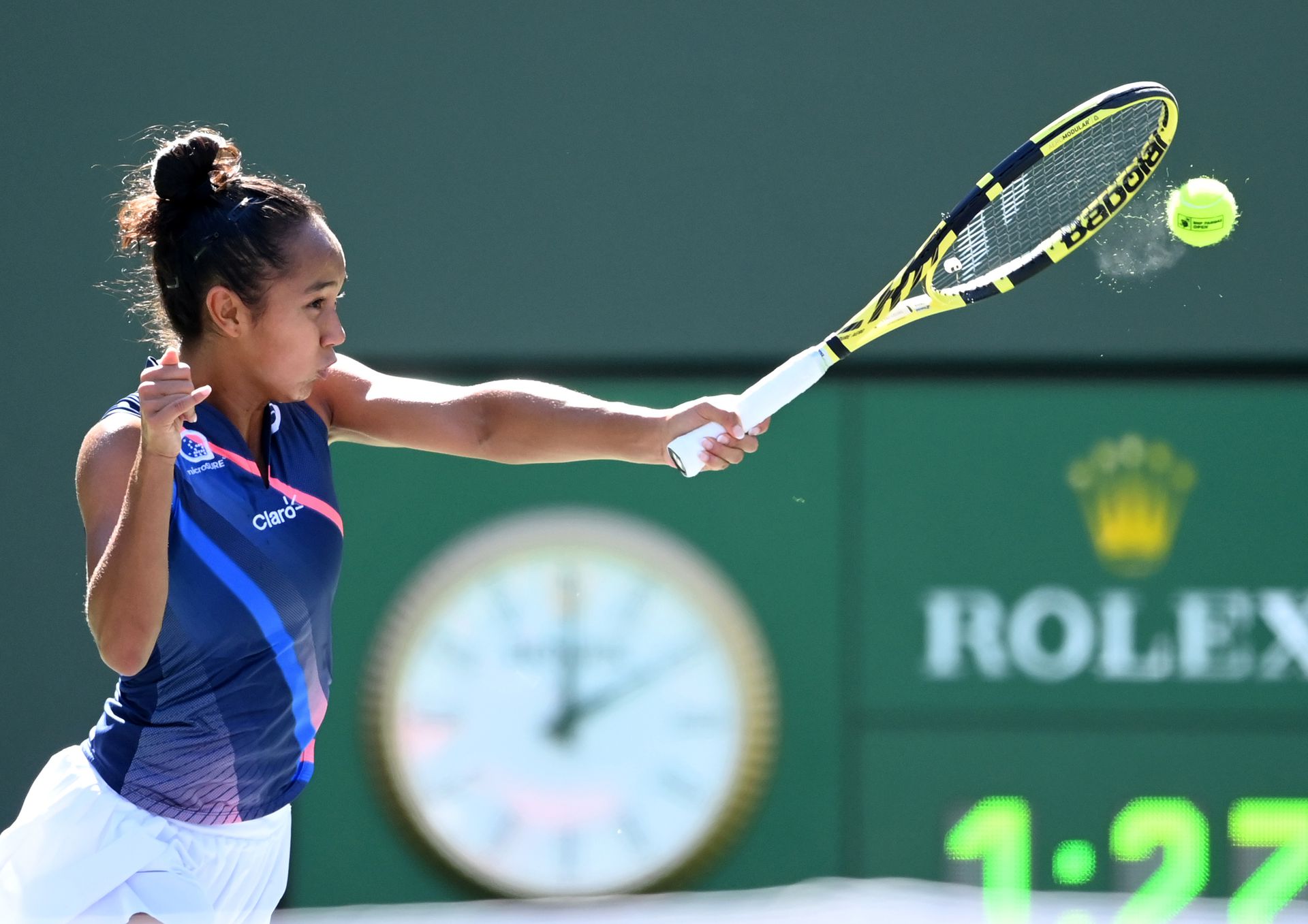  Leyla Fernandez of Canada hits a shot against Shelby Rogers of the U.S. during a fourth round match in the BNP Paribas Open at the Indian Wells Tennis Garden, Tuesday.