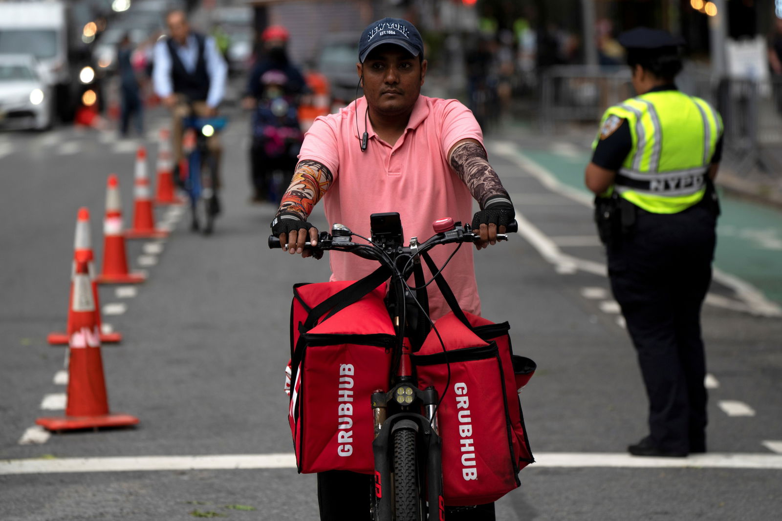 A delivery worker is pictured on the street in New York City on Sept. 23, 2021.