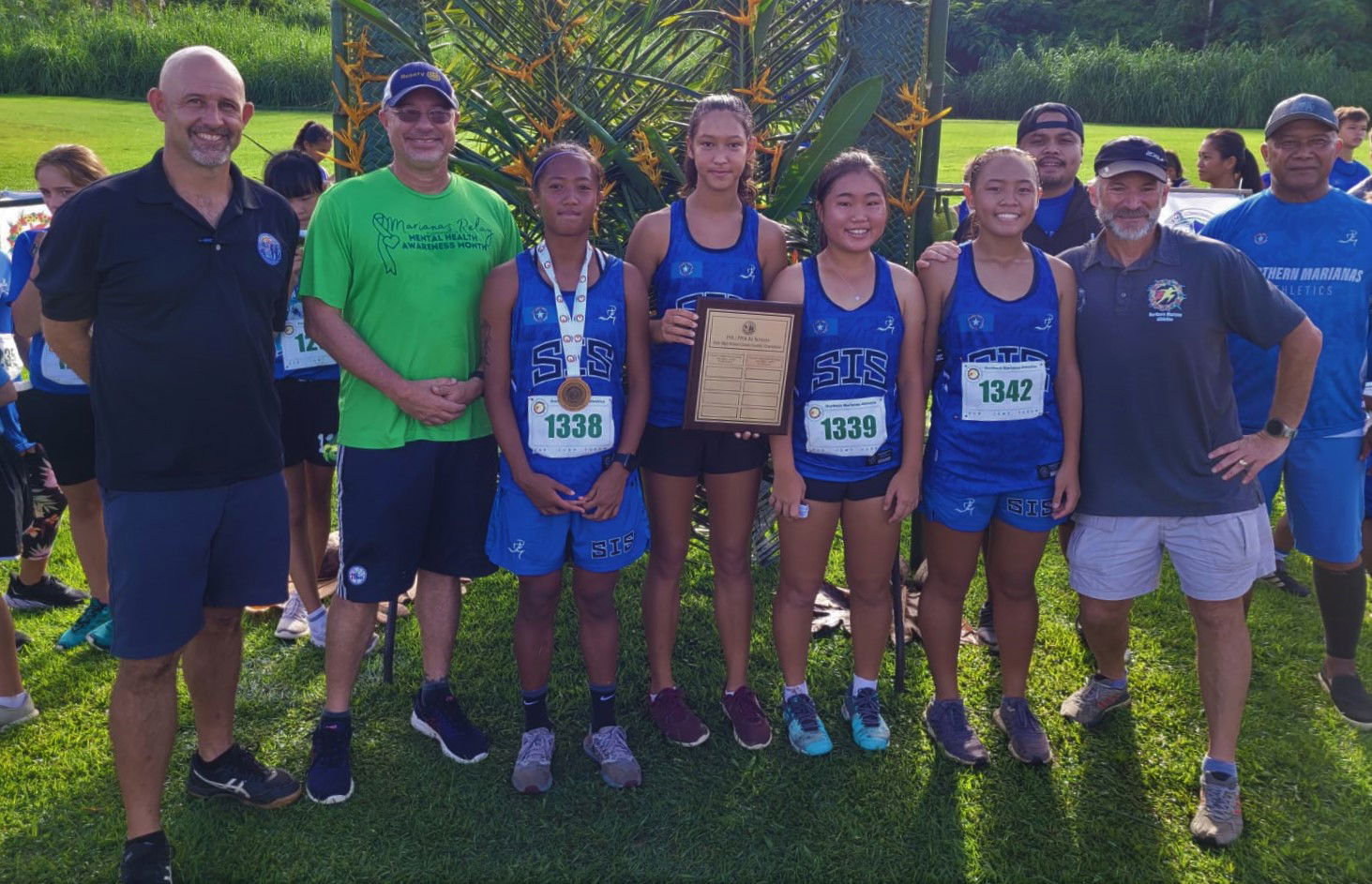 The Saipan International School girls pose with their championship trophy during the awards ceremony Saturday of the NMA-PSS All School Cross Country at the Saipan Country Club.