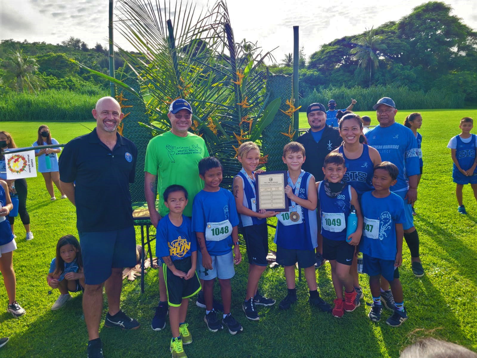 The Saipan International School elementary boys pose with their championship trophy during the  awards ceremony of the NMA-PSS All School Cross Country Saturday at the Saipan Country Club.