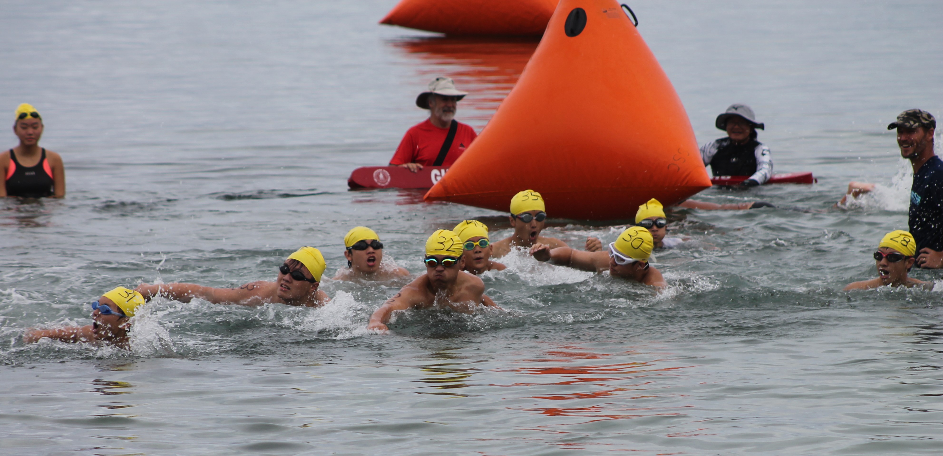 The 50m teens head for the finish line during the Saipan Swim Club Triple Crown Open Water Swim Series on Saturday at  Guma Sakman beach.
