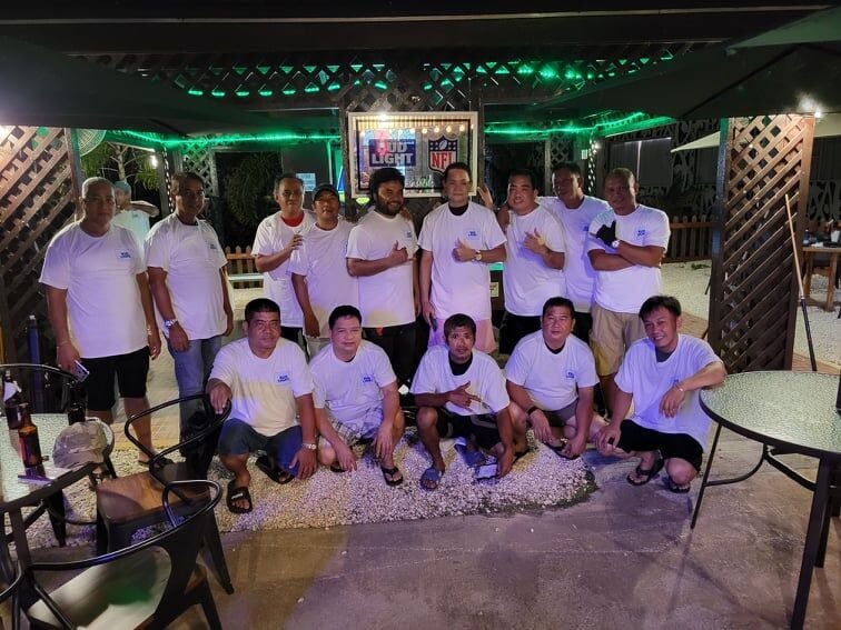 The players of the Budweiser/New Bamboo Battle of the Champions 8 Ball Tournament pose for a photo on Wednesday last week at Saipan Vegas.
