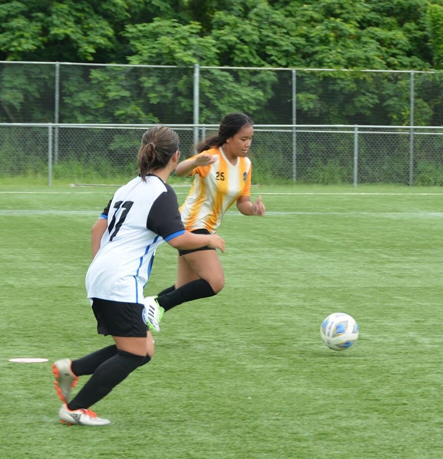 Kanoa Football Club’s Keziah Manabat follows through the lead pass for the finish during a U15 Girls Division game of the Youth League Fall tournament Saturday at the NMI Soccer Training Center.