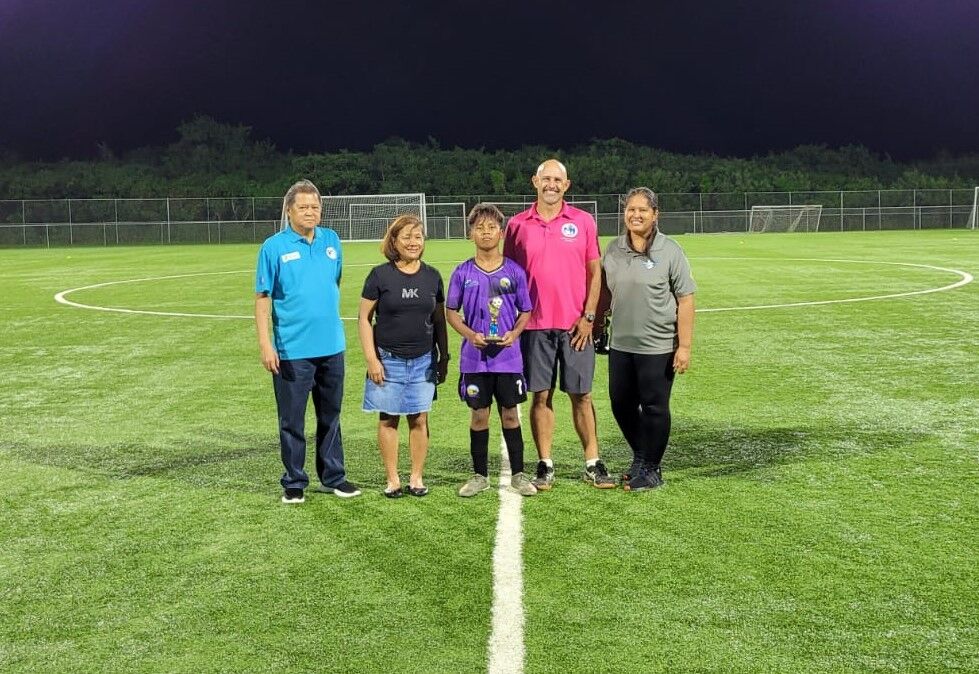 Hopwood’s Tyler Omelau, the Finals MVP, poses for a photo with NMI Football Association's Ross Zapanta, NMIFA’s Elna Curate, PSS Athletic Director Nick Gross and NMIFA's Catherine Attao-Toves during Friday's awards ceremony at the NMI Soccer Training Center.