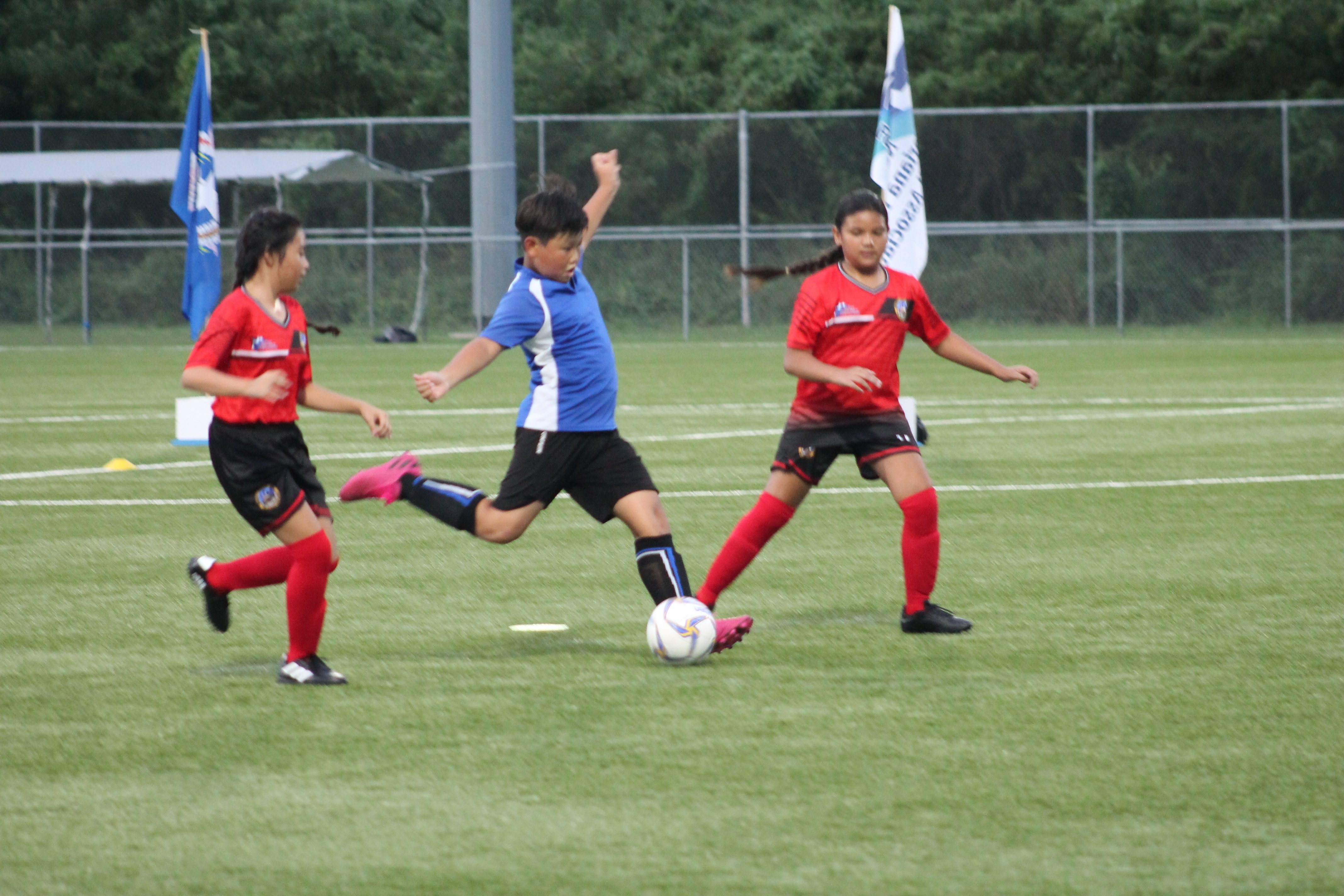 Saipan International School’s Juwon Lee winds up for the shot during the championship game of the NMIFA-PSS Interscholastic Elementary Division at the NMI Soccer Training Center.