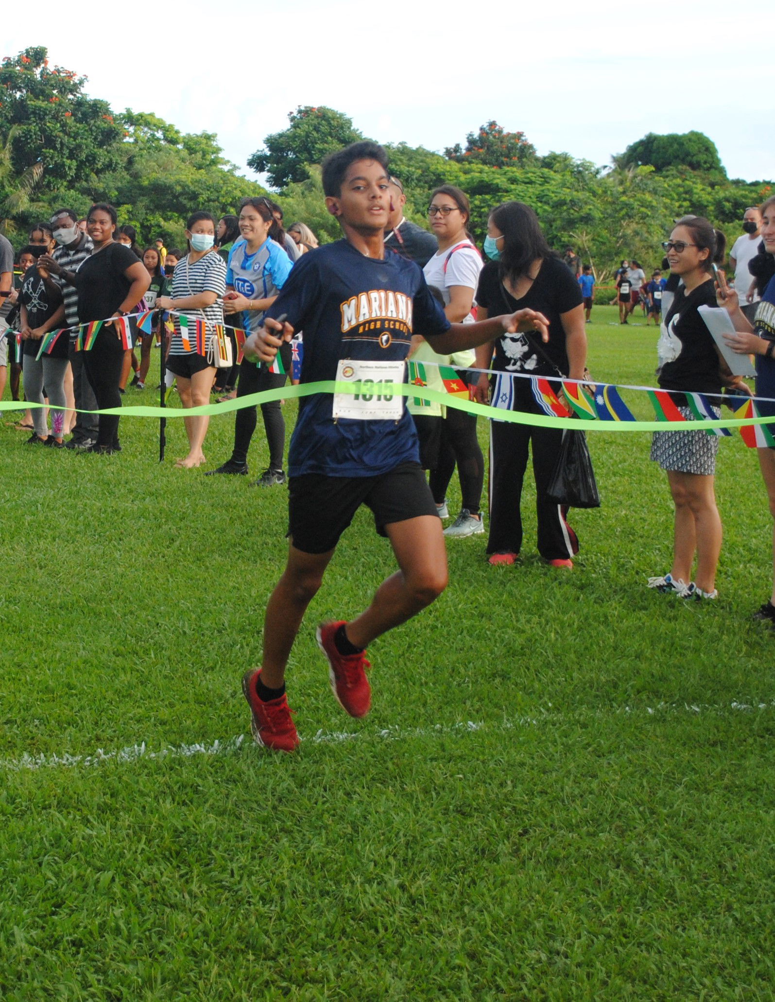Marianas High School’s Dev Bachani crosses the finish line to top the Boys High School Division of the NMA-PSS All School Cross Country Saturday at the Saipan Country Club.