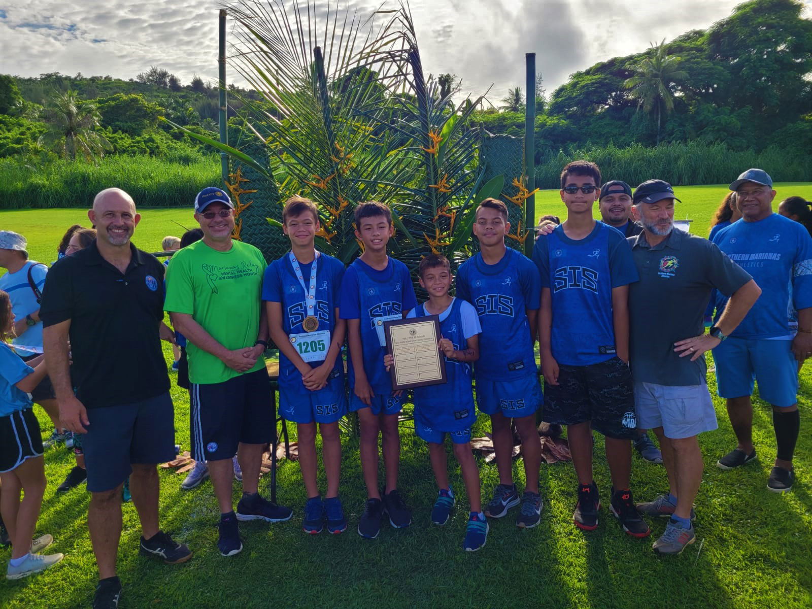 The Saipan International School middle school boys pose with their championship trophy during the  awards ceremony of the NMA-PSS All School Cross Country Saturday at the Saipan Country Club.