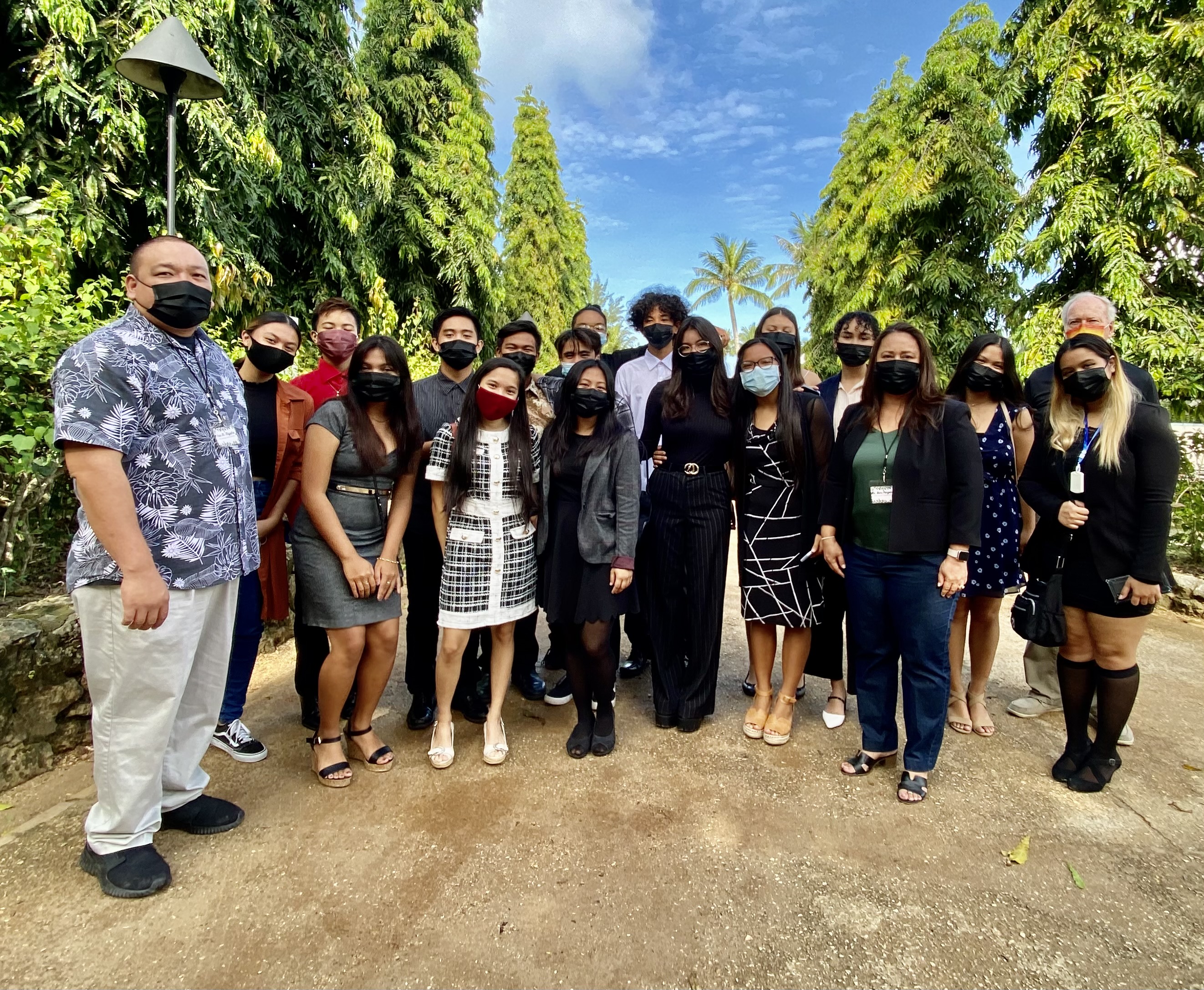 Acting Education Commissioner Eric Magofna, PSS Senior Director Dr. Yvonne Pangelinan and club adviser Harold Easton with the Marianas High School Glee Club which opened the summit by singing  the national and CNMI anthems.