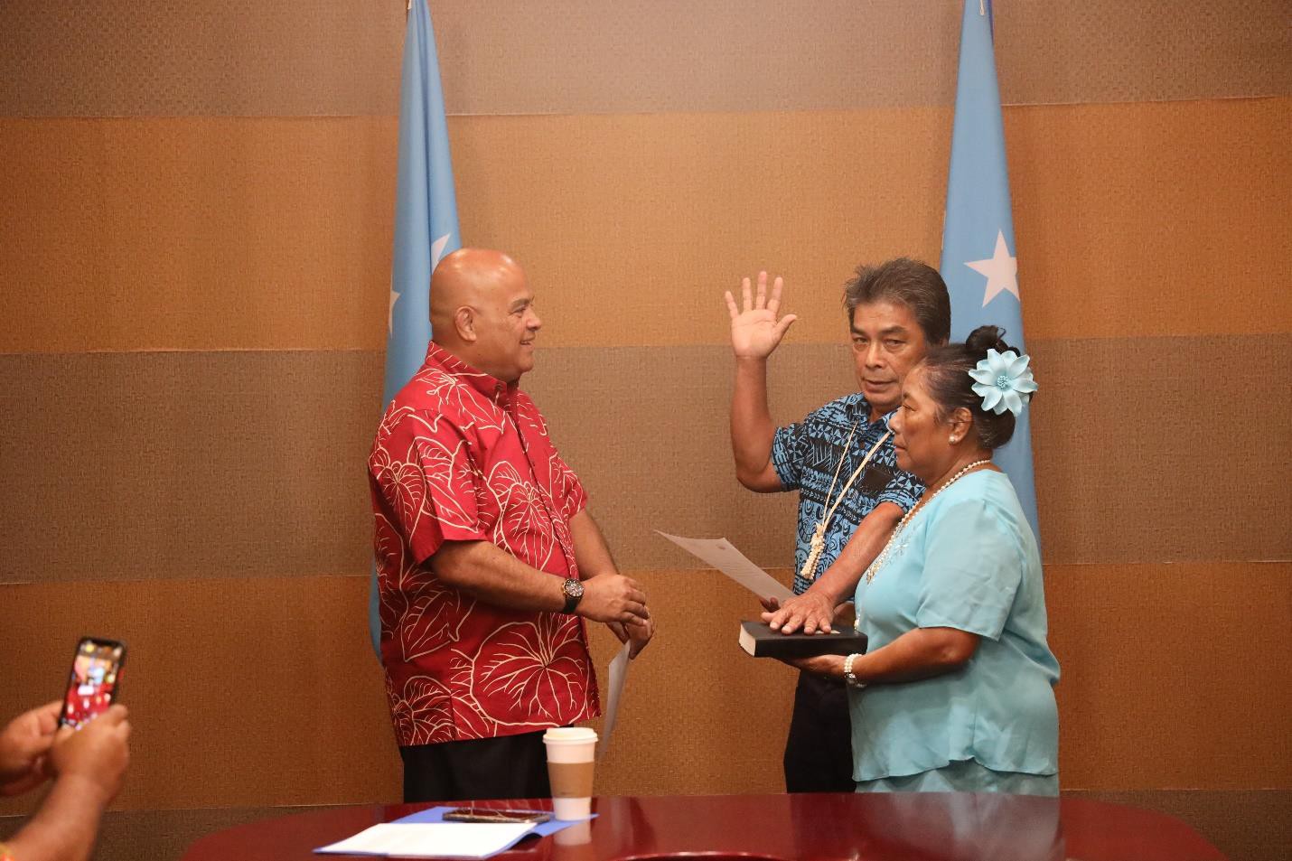 FSM National Election Office Director Ausen Lambert takes his oath of office.