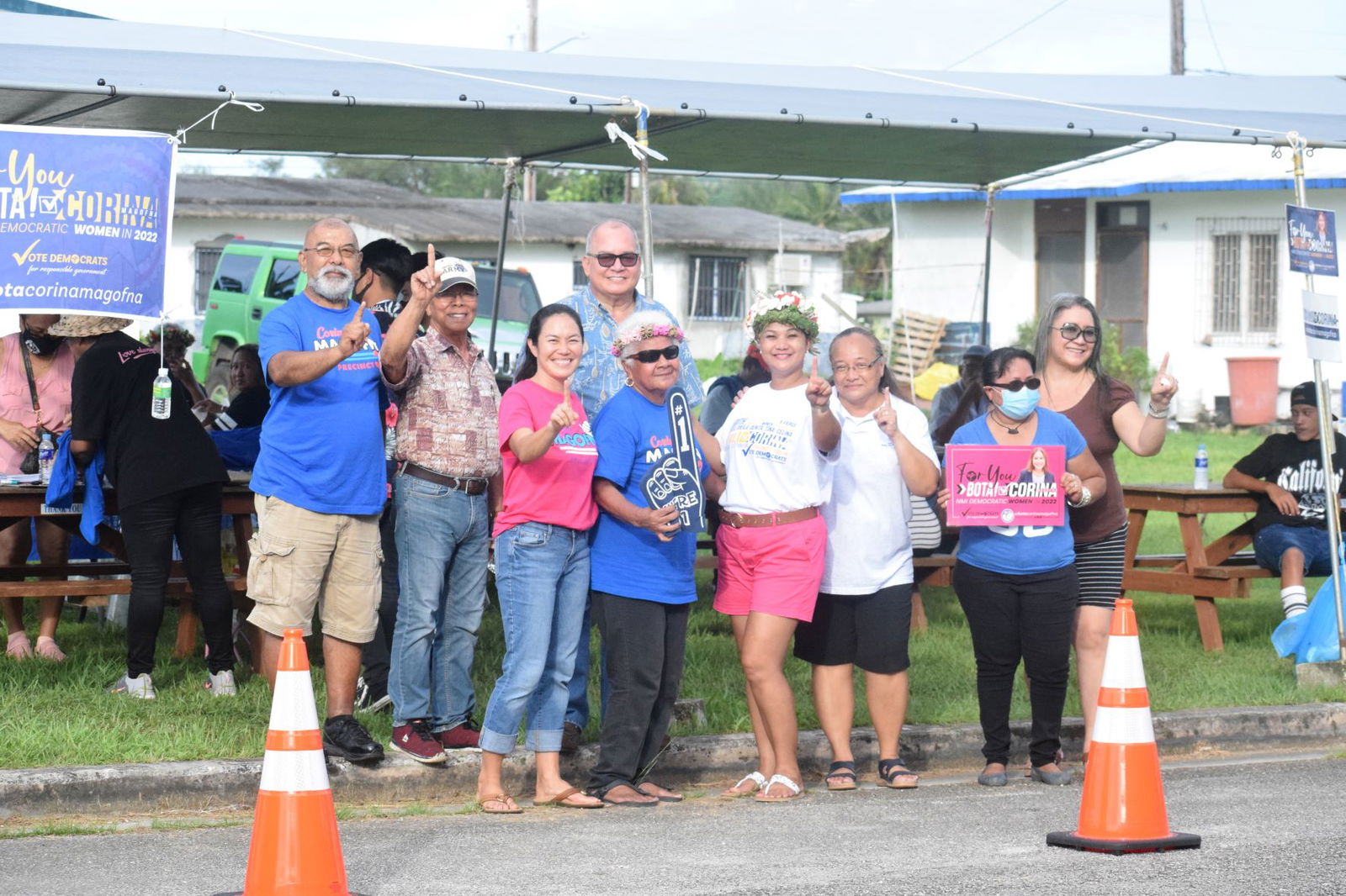 NMI Democratic Party Precinct 3 House candidate Corina L. Magofna, fourth right, poses for a photo with U.S. Congressman Gregorio Kilili Camacho Sablan, Democratic lawmakers and other supporters at a canopy near Garapan Elementary School on Saturday.
