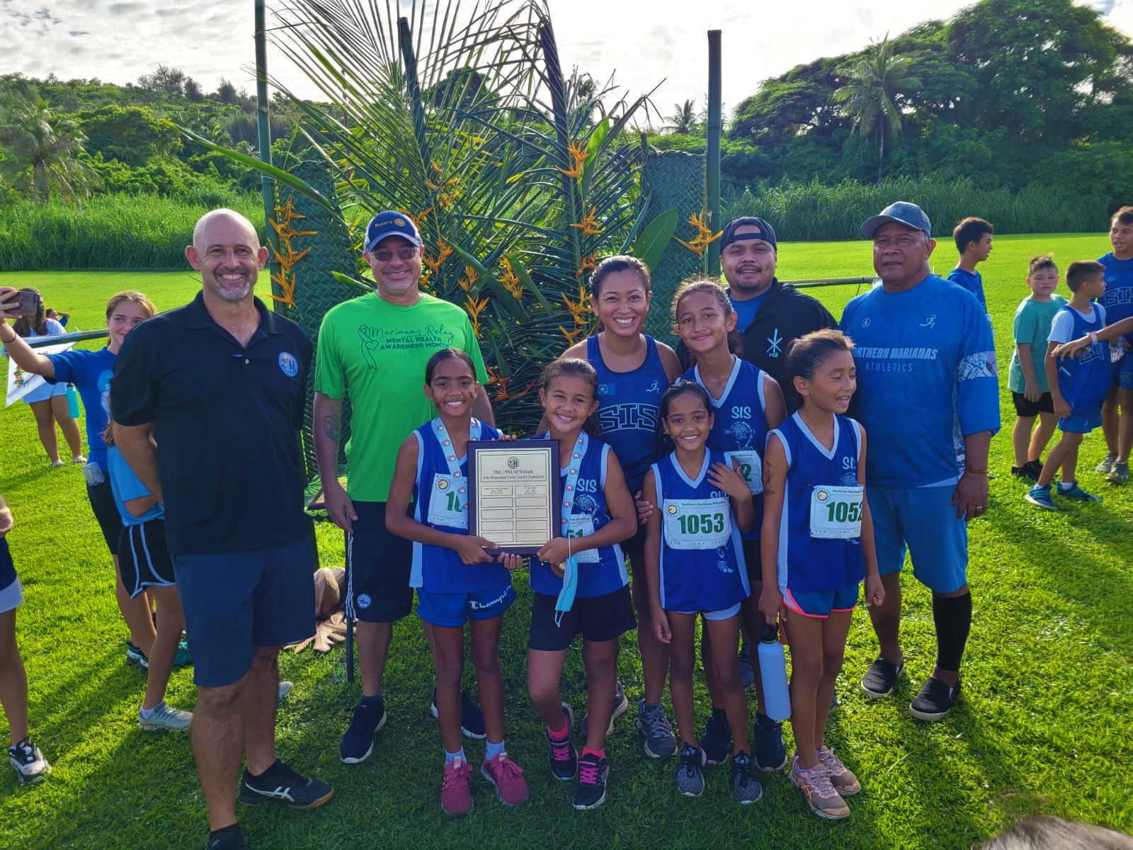 The Saipan International School elementary girls pose with their championship trophy during the  awards ceremony of the NMA-PSS All School Cross Country Saturday at the Saipan Country Club.
