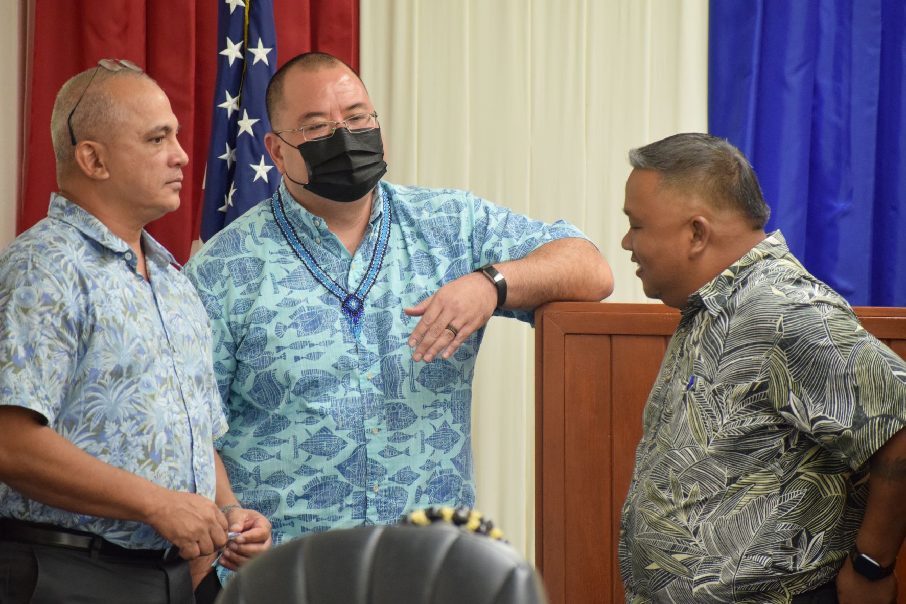 Rep. Joseph Flores, left, with Speaker Edmund Villagomez, center, and House Minority Leader Angel A. Demapan during a short break from the House session on Friday.
