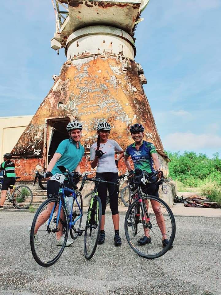 Jay-Anne Felipe, center, poses with fellow bikers after completing the Hell of the Marianas Race Series 1: Radar Challenge on Sunday.