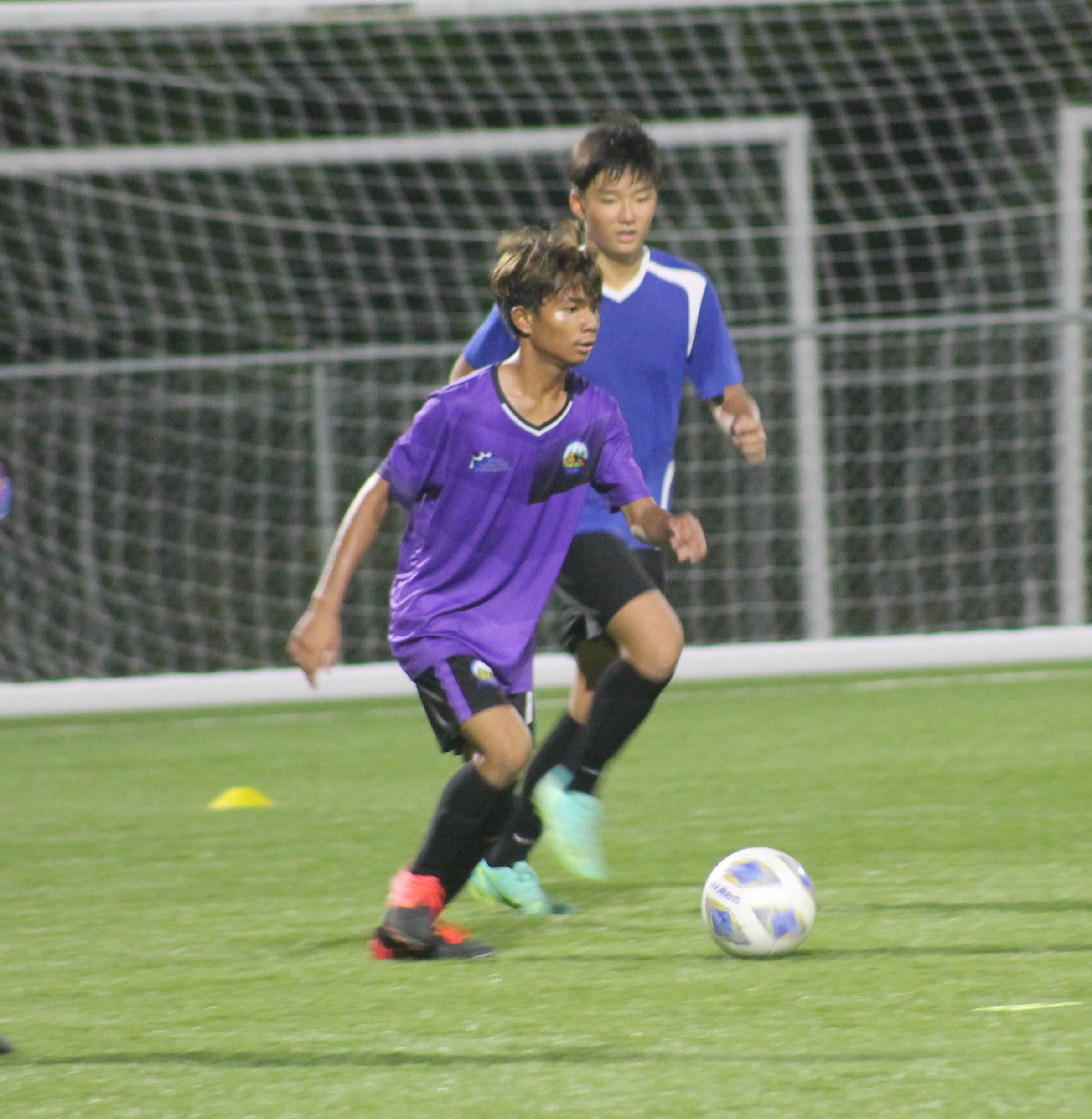 Hopwood’s Mark Costales looks on as he sets up the play during Friday's championship game at the NMI Soccer Training Center.