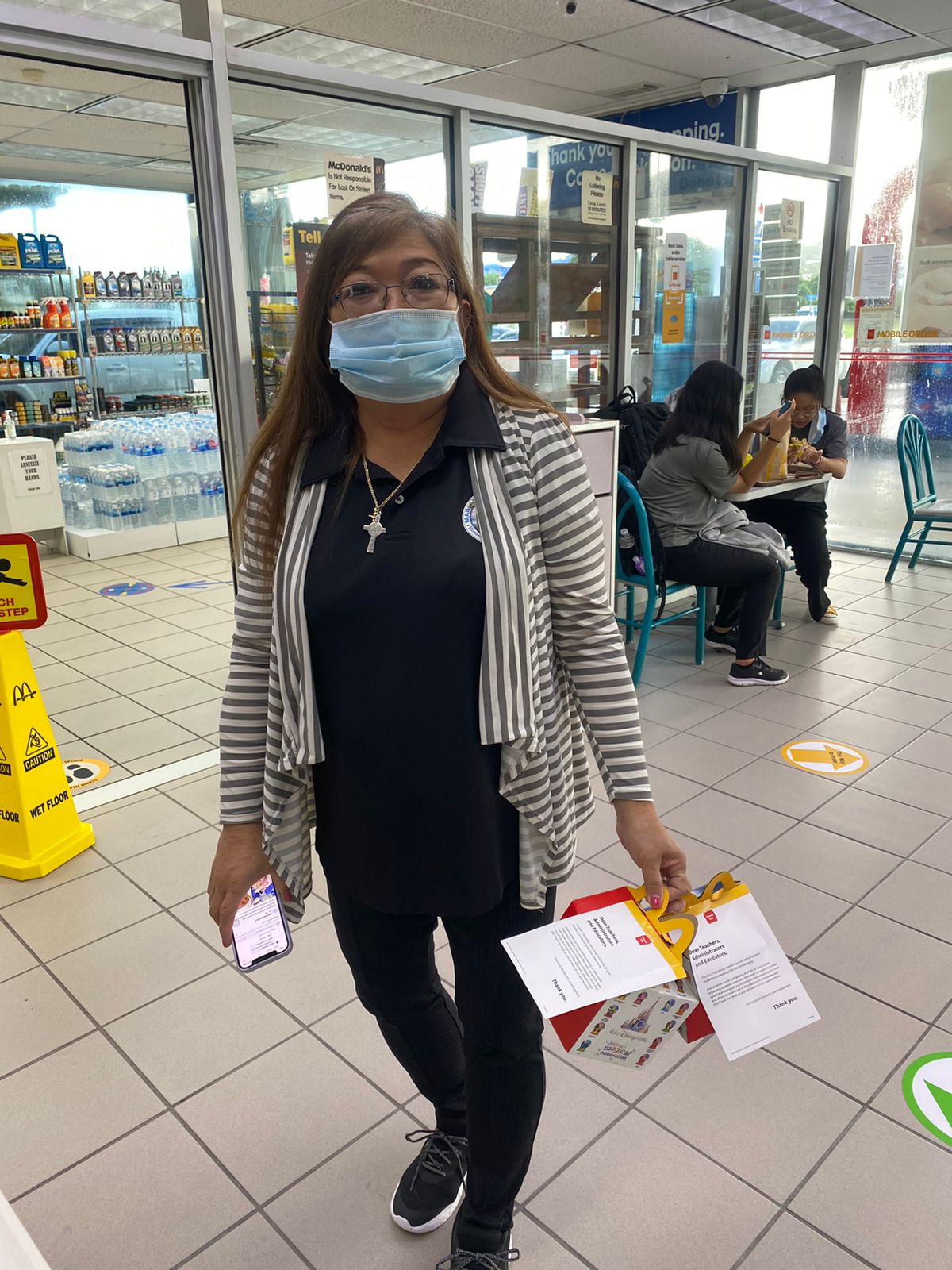 A Marianas High School teacher picks up her free “Thank You Meal for Educators” at the McDonald's Garapan branch counter last week.